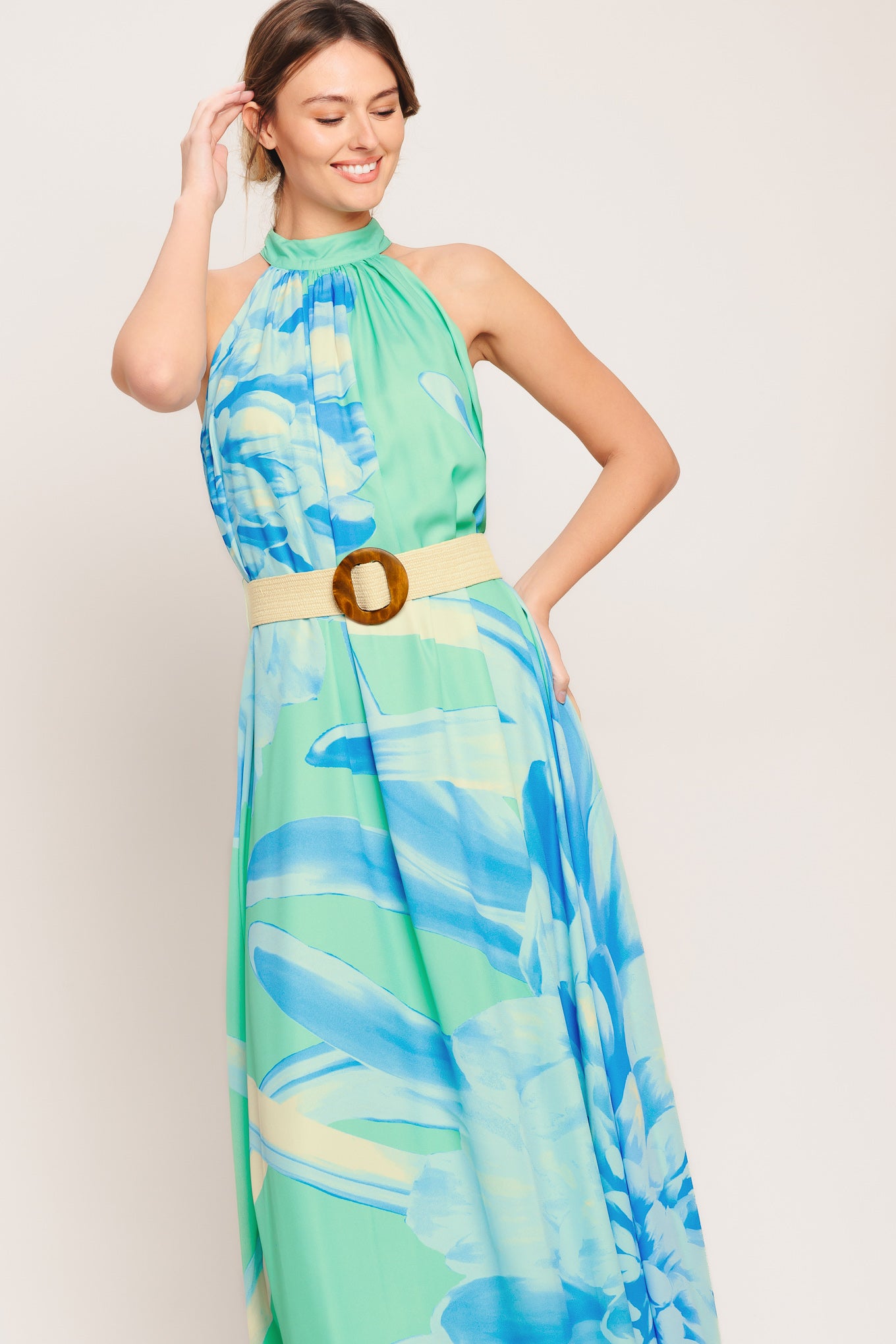 A printed woven maxi dress featuring halter neckline, contrasting belt and back button closure

Details:

Self: 100% Polyester

Lining: 100% Polyester

Size & Fit

-Model is 5`8" And Wearing Size Small
-Measurements Taken From Size Small
-Approx. Length: 61"