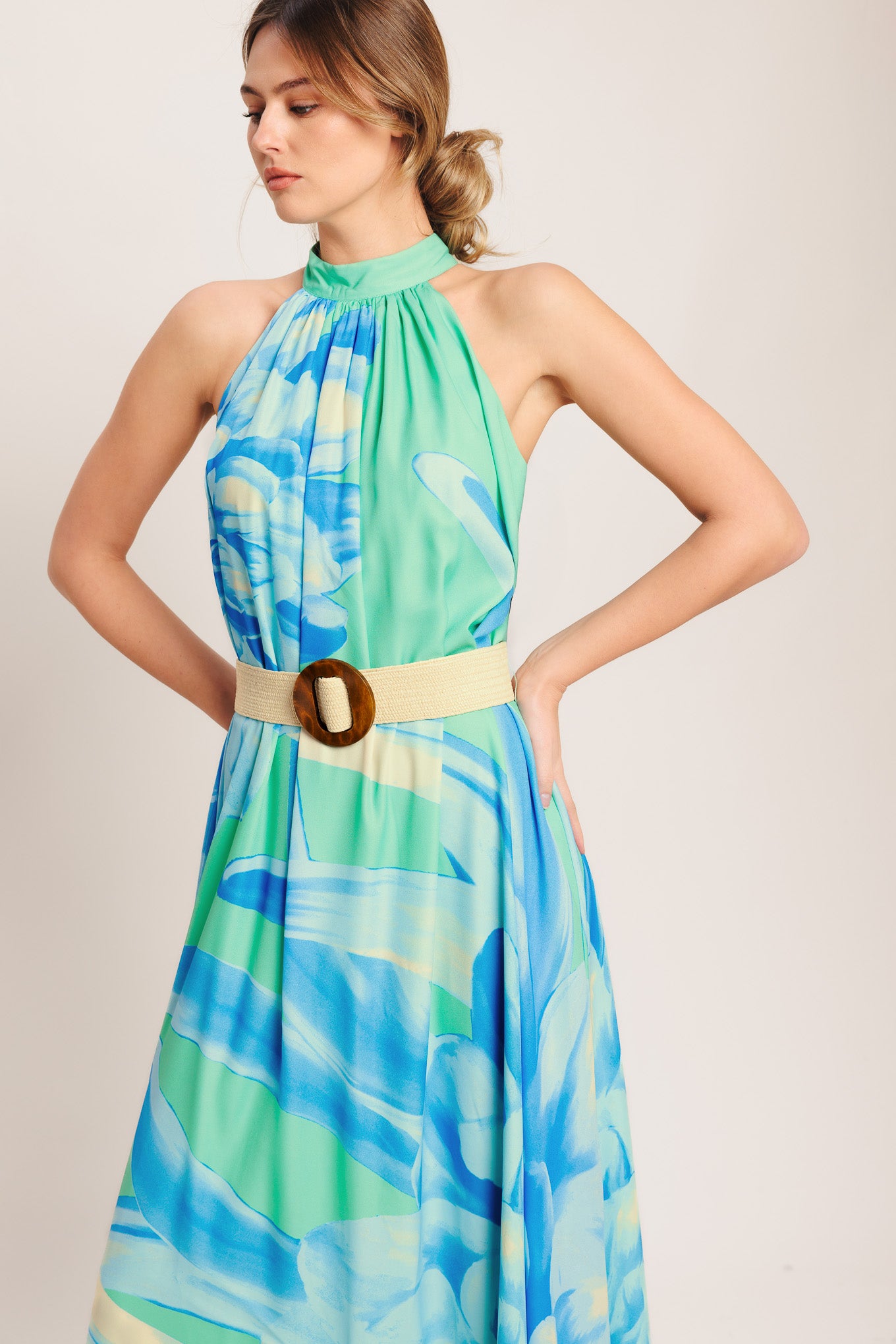 A printed woven maxi dress featuring halter neckline, contrasting belt and back button closure

Details:

Self: 100% Polyester

Lining: 100% Polyester

Size & Fit

-Model is 5`8" And Wearing Size Small
-Measurements Taken From Size Small
-Approx. Length: 61"