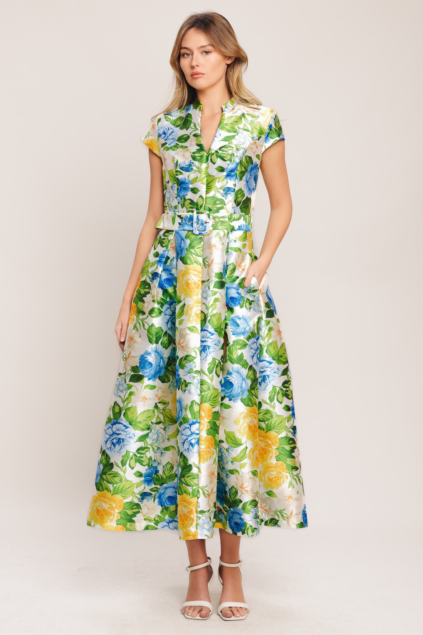 A printed woven midi dress featuring high collar with V front, short sleeve, self belt, full skirt and back zipper closure

Details:

Self: 100% Polyester

Size & Fit

-Model is 5`8" And Wearing Size Small
-Measurements Taken From Size Small
-Approx. Length: 54"