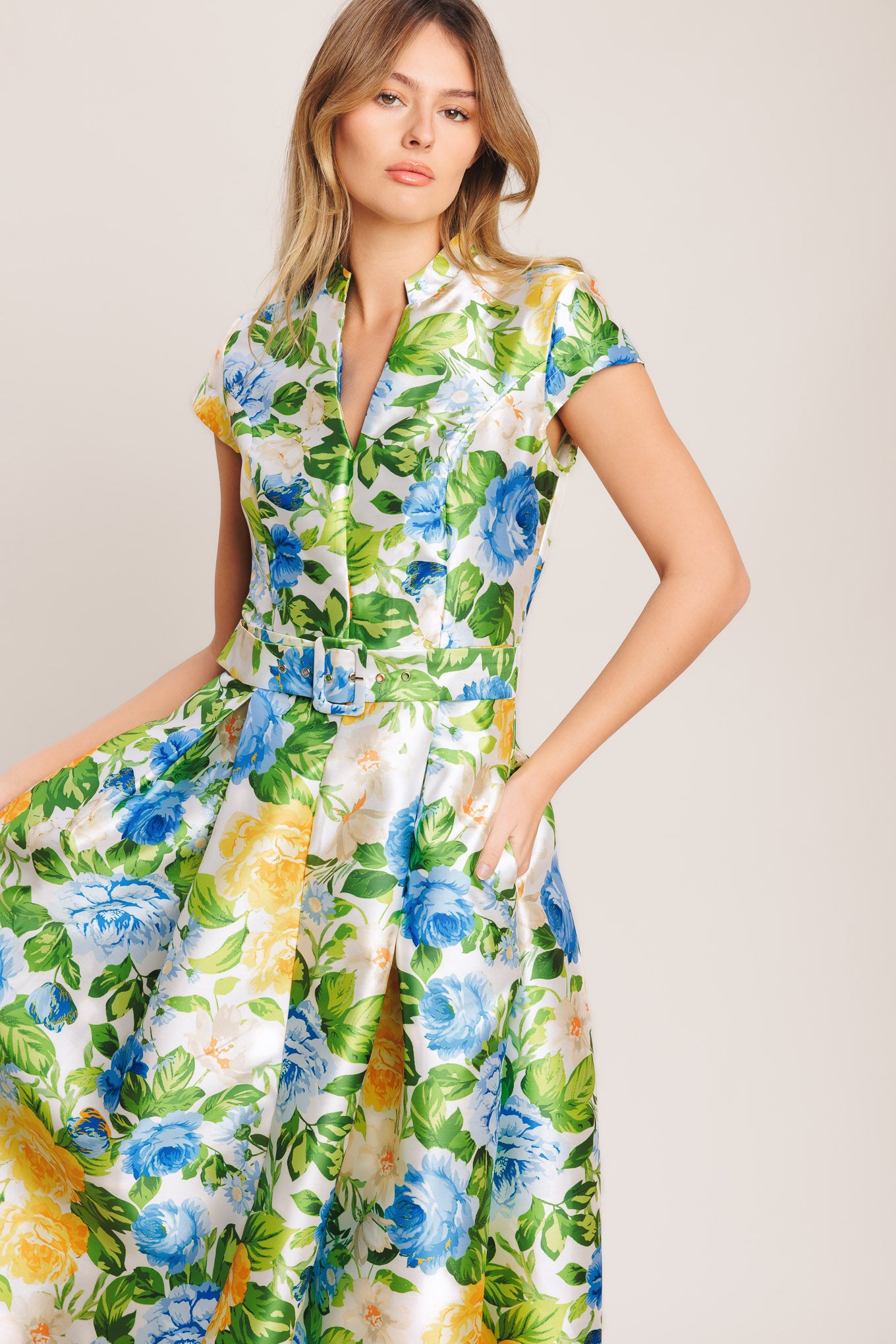 A printed woven midi dress featuring high collar with V front, short sleeve, self belt, full skirt and back zipper closure

Details:

Self: 100% Polyester

Size & Fit

-Model is 5`8" And Wearing Size Small
-Measurements Taken From Size Small
-Approx. Length: 54"