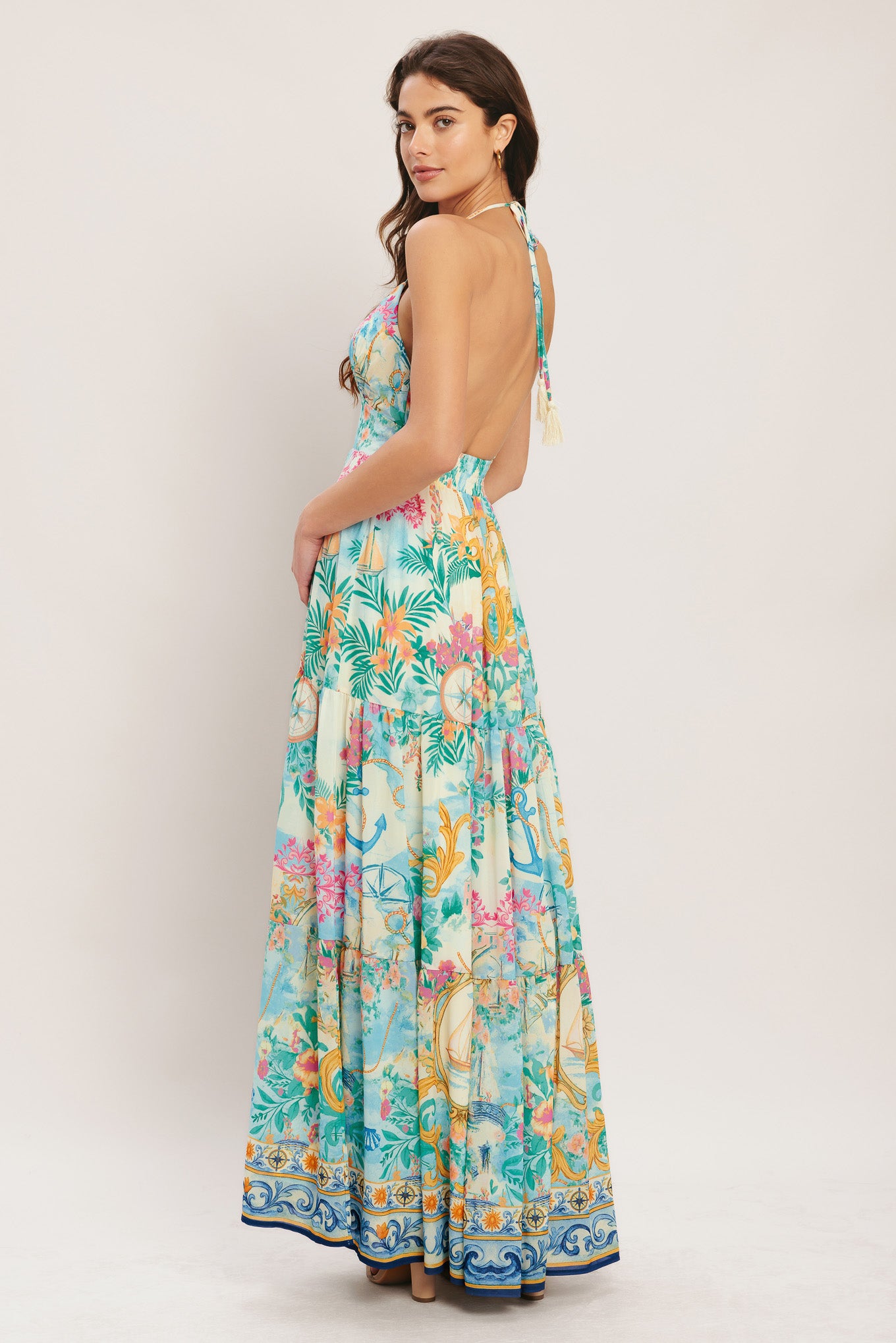 
A printed woven maxi dress featuring cami top with halter tie, waist yoke, tier skirt, low back and smocked back waistband

Details:

Self : 100% Polyester
Lining : 100% Polyester

Size &amp; Fit

- Model is 5`8" And Wearing Size Small
- Measurements Taken From Size Small
- Approx. Length: 58"