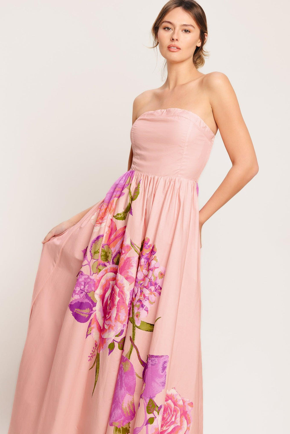 A printed woven maxi dress featuring strapless, full skirt and smocked back bodice

Details:

Self: 100% Cotton

Lining: 100% Polyester

Size & Fit

-Model is 5`8" And Wearing Size Small
-Measurements Taken From Size Small
-Approx. Length: 52"