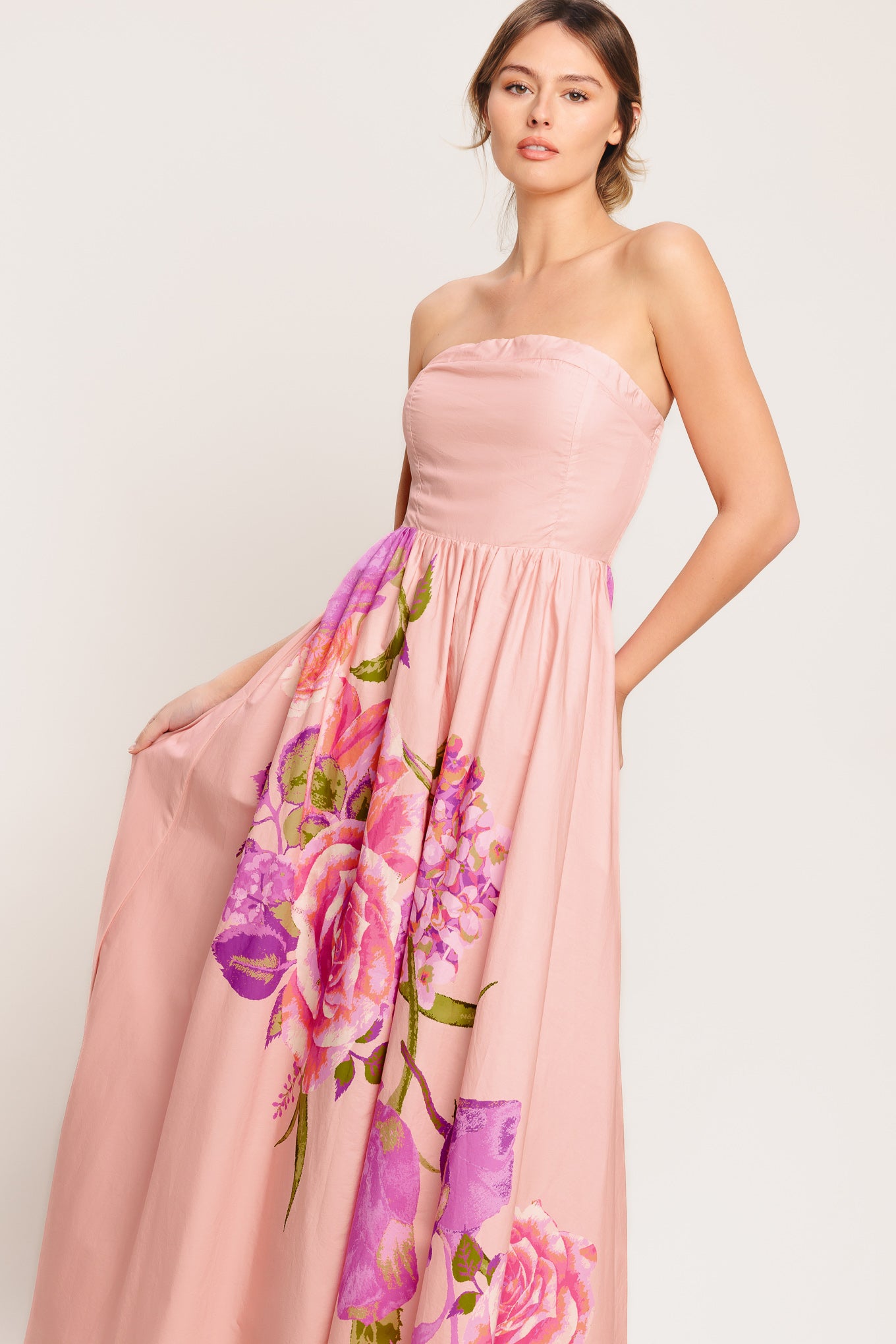 A printed woven maxi dress featuring strapless, full skirt and smocked back bodice

Details:

Self: 100% Cotton

Lining: 100% Polyester

Size & Fit

-Model is 5`8" And Wearing Size Small
-Measurements Taken From Size Small
-Approx. Length: 52"