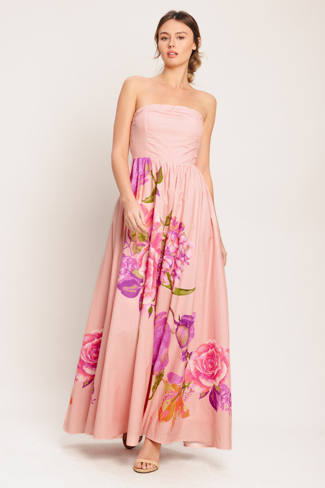 A printed woven maxi dress featuring strapless, full skirt and smocked back bodice

Details:

Self: 100% Cotton

Lining: 100% Polyester

Size & Fit

-Model is 5`8" And Wearing Size Small
-Measurements Taken From Size Small
-Approx. Length: 52"