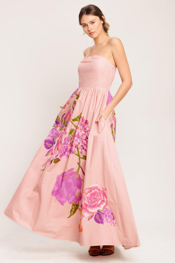 A printed woven maxi dress featuring strapless, full skirt and smocked back bodice

Details:

Self: 100% Cotton

Lining: 100% Polyester

Size & Fit

-Model is 5`8" And Wearing Size Small
-Measurements Taken From Size Small
-Approx. Length: 52"