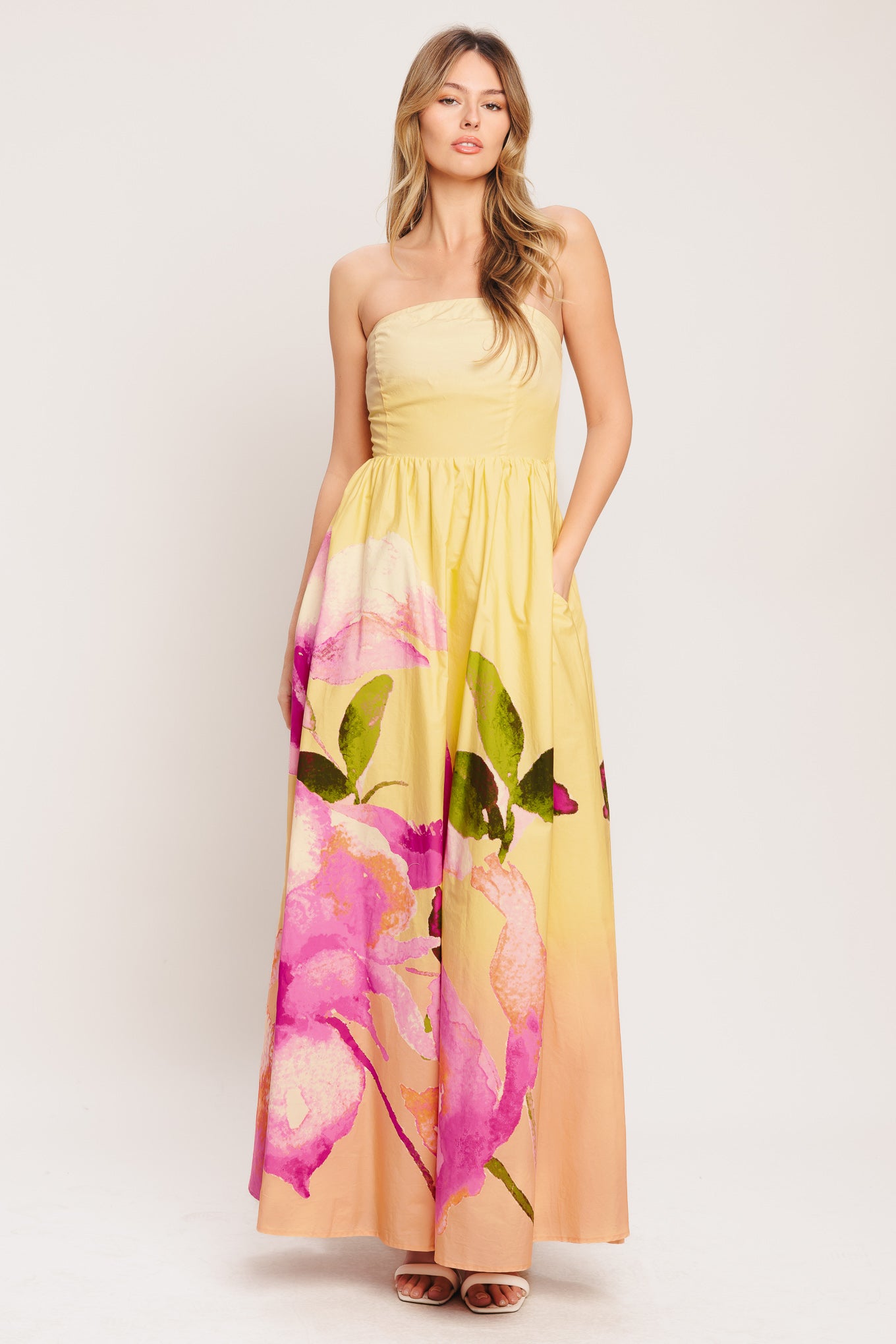 A printed woven maxi dress featuring strapless, full skirt and smocked back bodice

Details:

Self: 100% Cotton

Lining: 100% Polyester

Size & Fit

-Model is 5`8" And Wearing Size Small
-Measurements Taken From Size Small
-Approx. Length: 53"