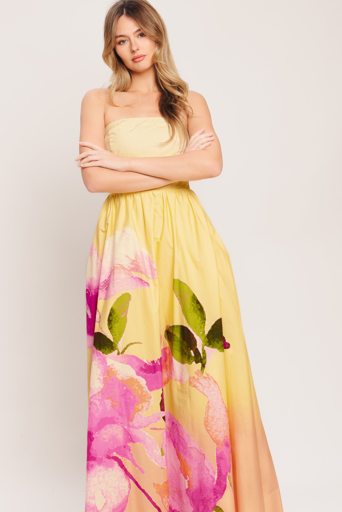 A printed woven maxi dress featuring strapless, full skirt and smocked back bodice

Details:

Self: 100% Cotton

Lining: 100% Polyester

Size & Fit

-Model is 5`8" And Wearing Size Small
-Measurements Taken From Size Small
-Approx. Length: 53"