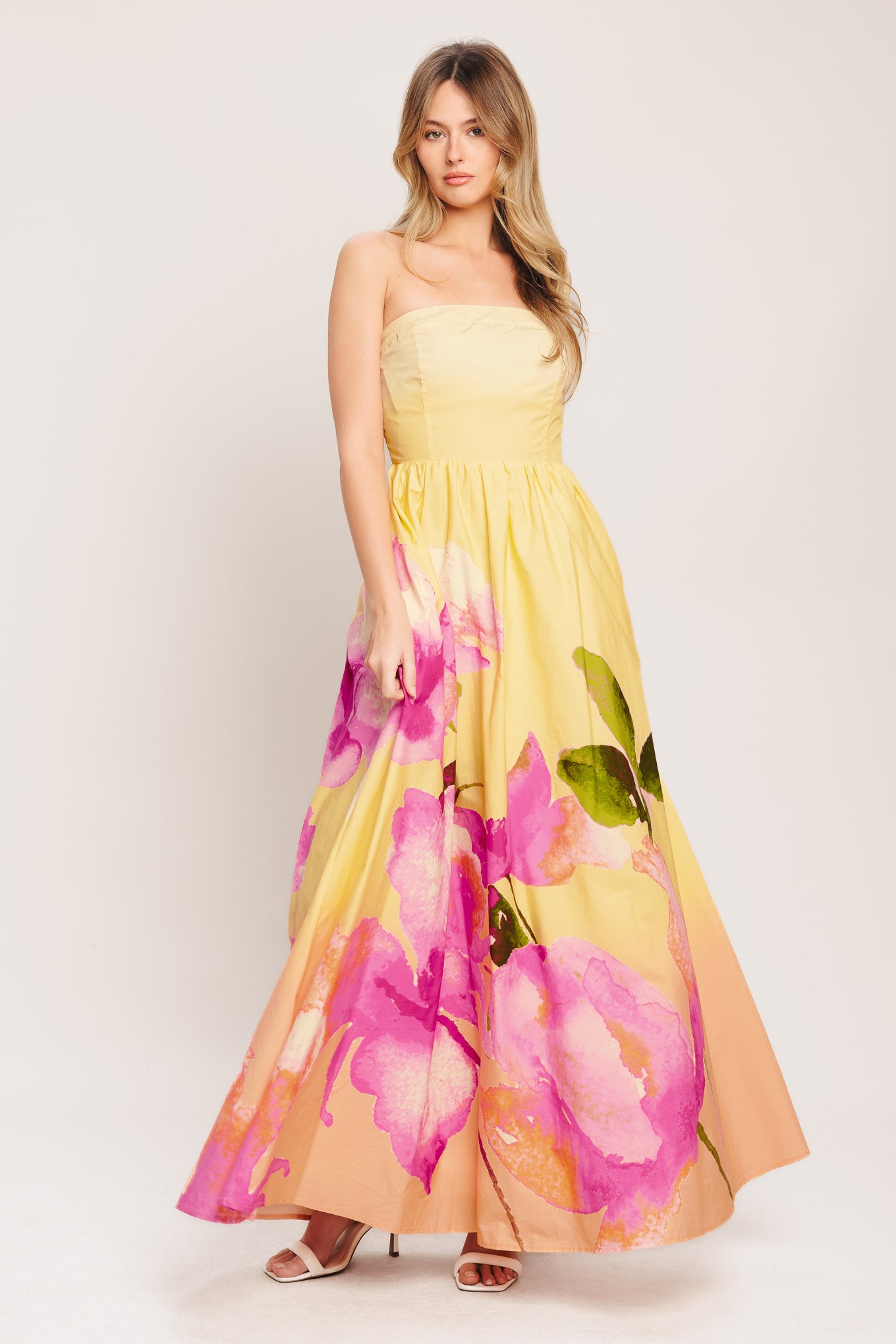 A printed woven maxi dress featuring strapless, full skirt and smocked back bodice

Details:

Self: 100% Cotton

Lining: 100% Polyester

Size & Fit

-Model is 5`8" And Wearing Size Small
-Measurements Taken From Size Small
-Approx. Length: 53"