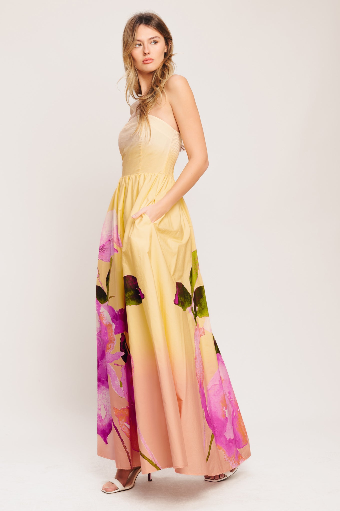 A printed woven maxi dress featuring strapless, full skirt and smocked back bodice

Details:

Self: 100% Cotton

Lining: 100% Polyester

Size & Fit

-Model is 5`8" And Wearing Size Small
-Measurements Taken From Size Small
-Approx. Length: 53"