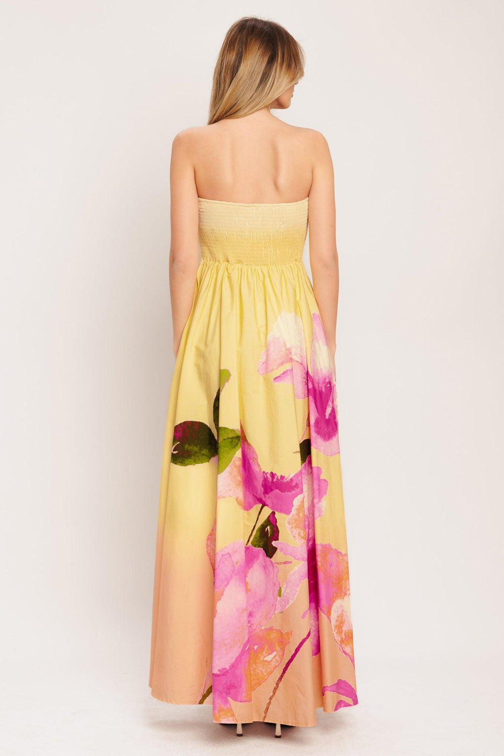 A printed woven maxi dress featuring strapless, full skirt and smocked back bodice

Details:

Self: 100% Cotton

Lining: 100% Polyester

Size & Fit

-Model is 5`8" And Wearing Size Small
-Measurements Taken From Size Small
-Approx. Length: 53"