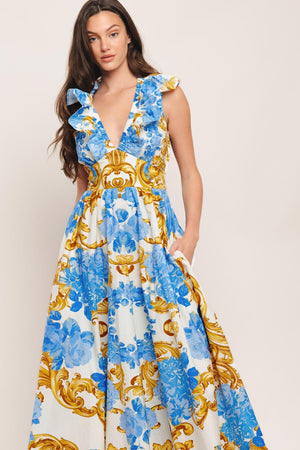 A printed woven midi dress featuring V neckline, ruffle collar, waist yoke, full skirt and smocked back waistband

Details:

Self: 100% Cotton

Size & Fit

-Model is 5`8" And Wearing Size Small
-Measurements Taken From Size Small
-Approx. Length: 53"