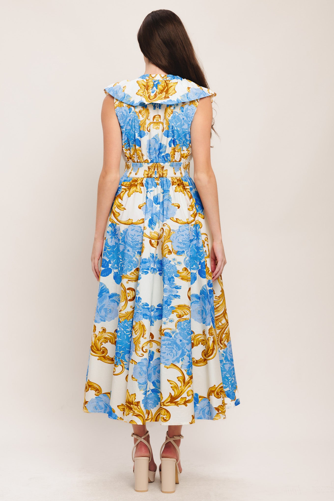 A printed woven midi dress featuring V neckline, ruffle collar, waist yoke, full skirt and smocked back waistband

Details:

Self: 100% Cotton

Size & Fit

-Model is 5`8" And Wearing Size Small
-Measurements Taken From Size Small
-Approx. Length: 53"