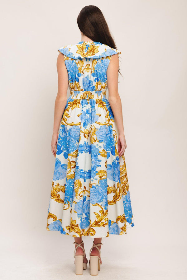 A printed woven midi dress featuring V neckline, ruffle collar, waist yoke, full skirt and smocked back waistband

Details:

Self: 100% Cotton

Size & Fit

-Model is 5`8" And Wearing Size Small
-Measurements Taken From Size Small
-Approx. Length: 53"