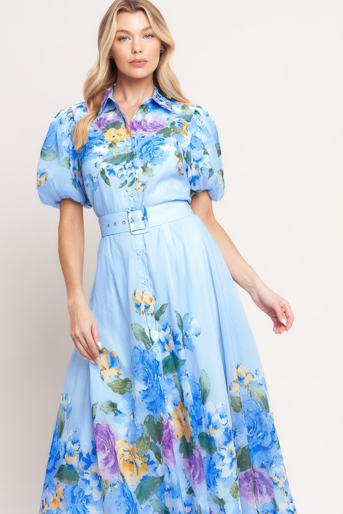 A printed woven midi dress featuring collar, short puff sleeve, front button down, self belt and circle skirt

Details:

Self: 100% Polyester

Lining: 100% Polyester

Size & Fit

-Model is 5`8" And Wearing Size Small
-Measurements Taken From Size Small
-Approx. Length: 52"