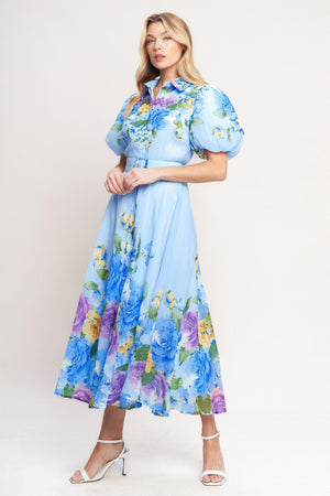 A printed woven midi dress featuring collar, short puff sleeve, front button down, self belt and circle skirt

Details:

Self: 100% Polyester

Lining: 100% Polyester

Size & Fit

-Model is 5`8" And Wearing Size Small
-Measurements Taken From Size Small
-Approx. Length: 52"