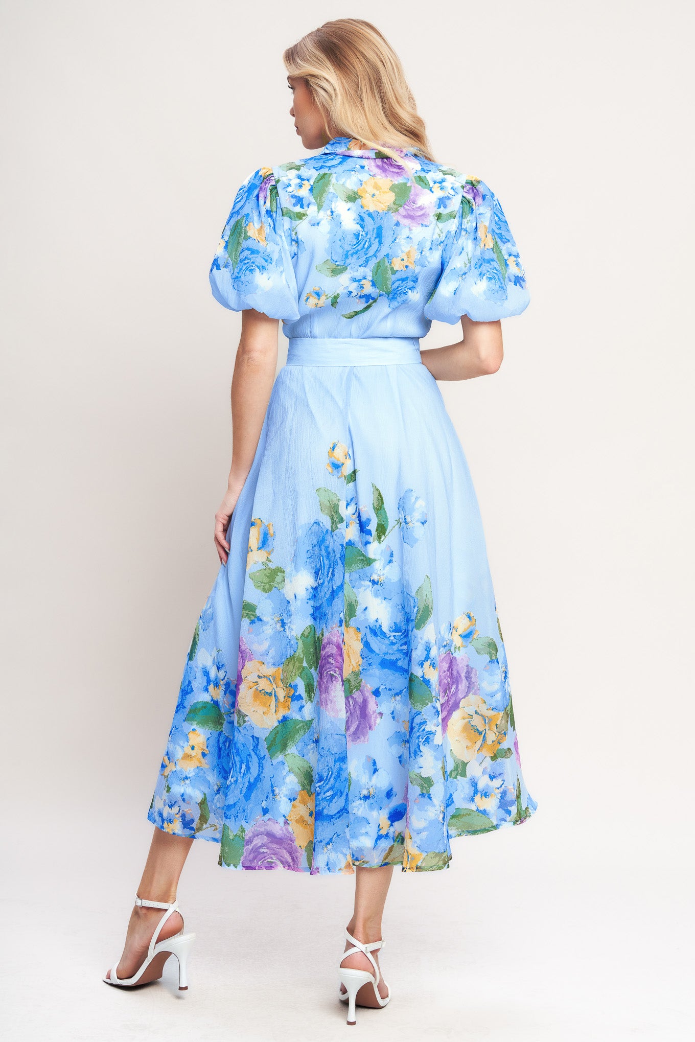 A printed woven midi dress featuring collar, short puff sleeve, front button down, self belt and circle skirt

Details:

Self: 100% Polyester

Lining: 100% Polyester

Size & Fit

-Model is 5`8" And Wearing Size Small
-Measurements Taken From Size Small
-Approx. Length: 52"
