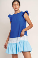 
A woven color blocked mini dress featuring round neckline, ruffle sleeve, ruffle hem and back neck button closure

Details:

Self : 100% Cotton
Contrast : 100% Cotton

Size &amp; Fit

- Model is 5`8" And Wearing Size Small
- Measurements Taken From Size Small
- Approx. Length: 35"
