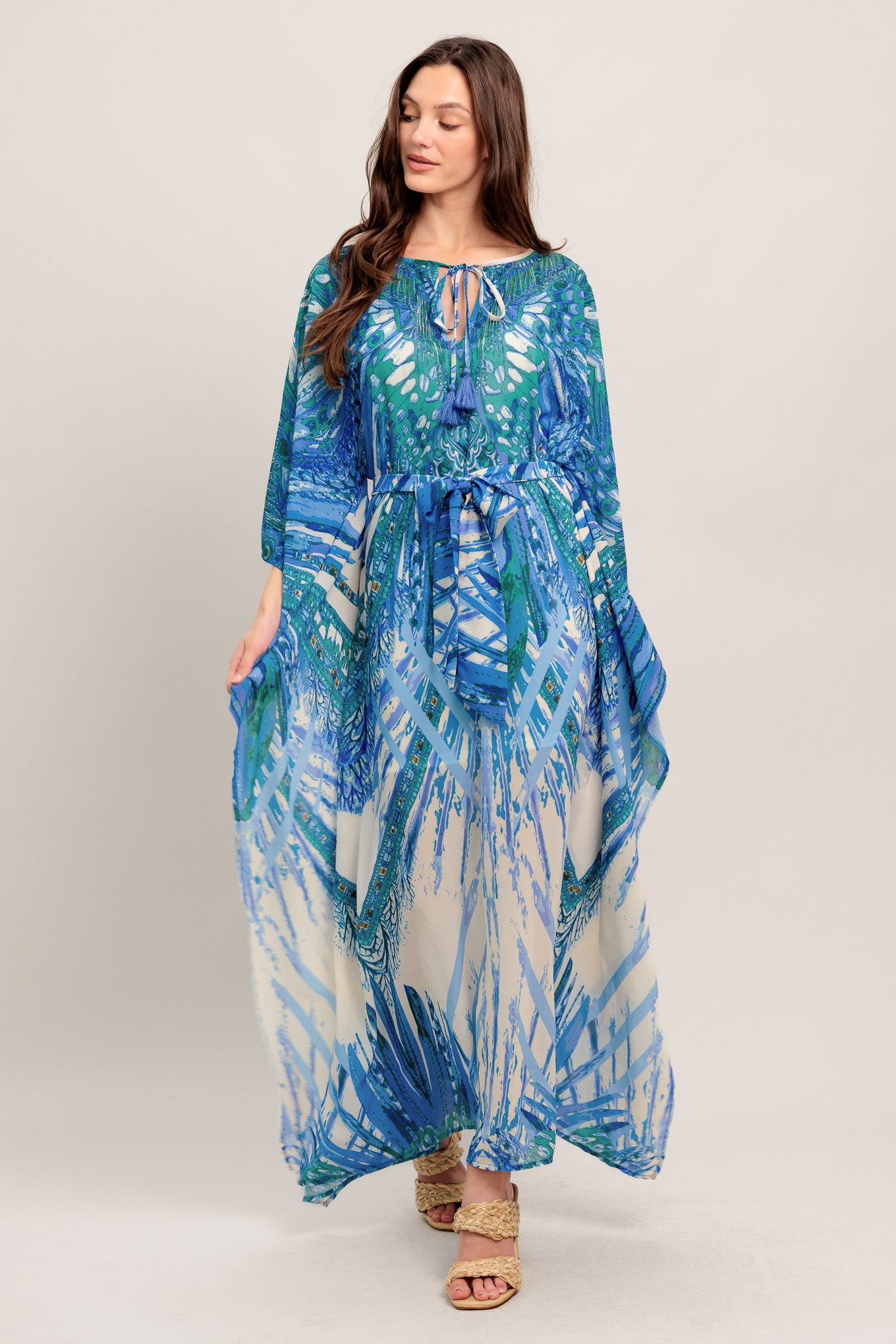 
A printed woven kaftan featuring round neckline with front tie/tassel and self sash tie

Details:

Self : 100% Polyester
Lining : 100% Polyester

Size &amp; Fit

- Model is 5`8" And Wearing Size Small
- Measurements Taken From Size Small
- Approx. Length: 60" FLYING TOMATO