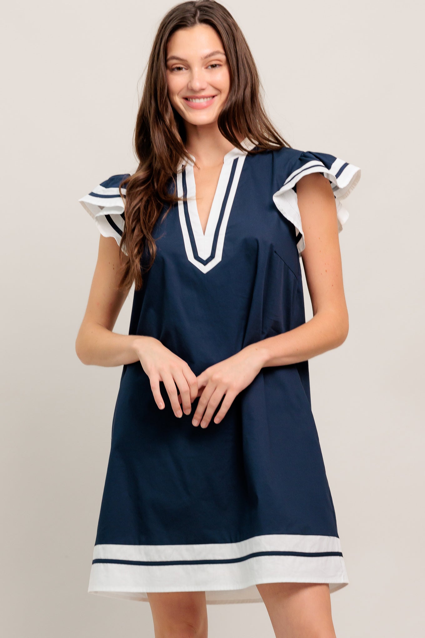 
A solid woven color blocked mini dress featuring V neckline and ruffle sleeve

Details:

Self : 100% Cotton
Contrast : 100% Cotton

Size &amp; Fit

- Model is 5`8" And Wearing Size Small
- Measurements Taken From Size Small
- Approx. Length: 35" Flying Tomato