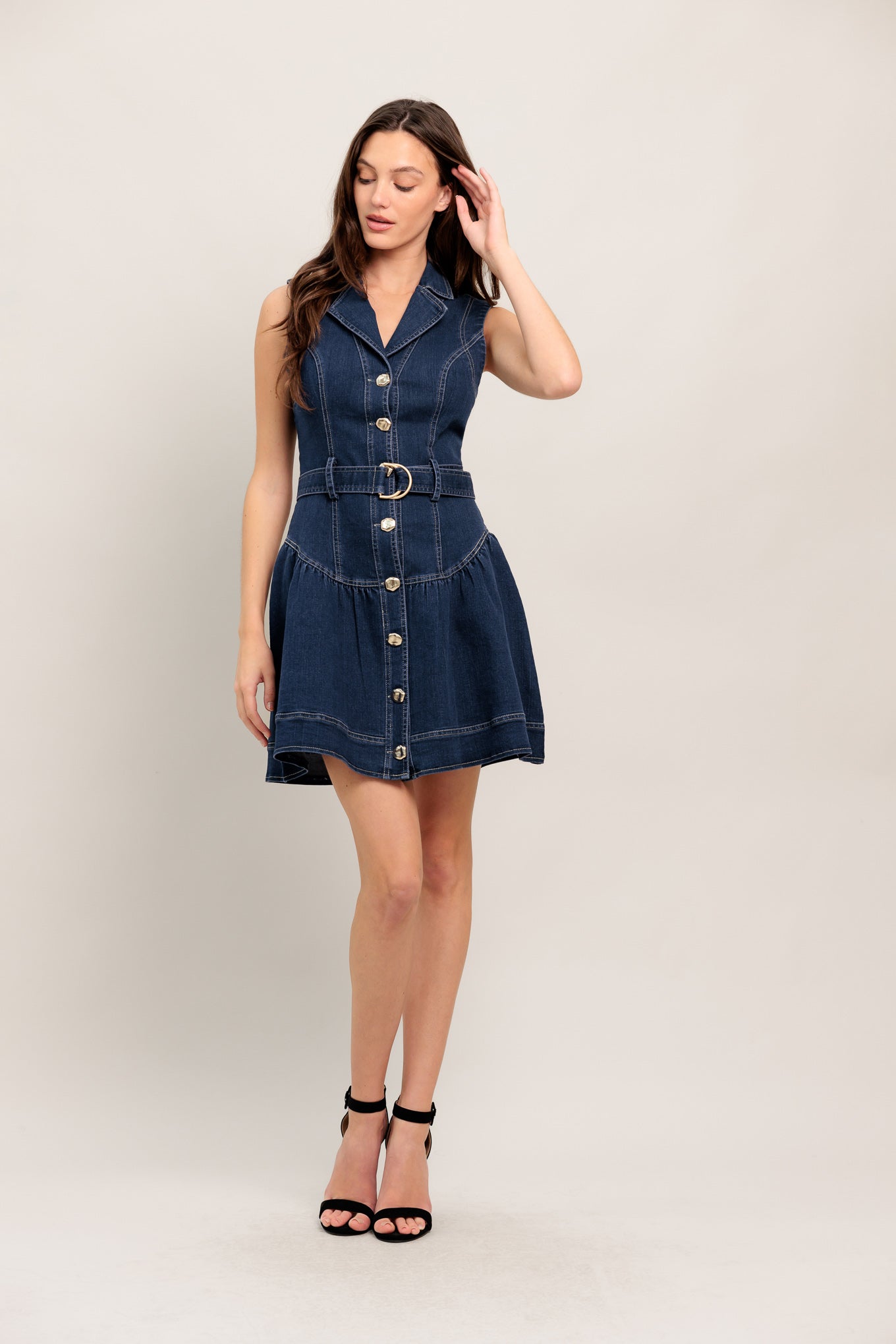 A denim mini dress featuring lapel, sleeveless, drop waistline, front button down and self belt

Details:

Self: 70% Cotton 28% Polyester 2% Spandex

Size & Fit

- Model is 5`8" And Wearing Size Small
- Measurements Taken From Size Small
- Approx. Length: 35"