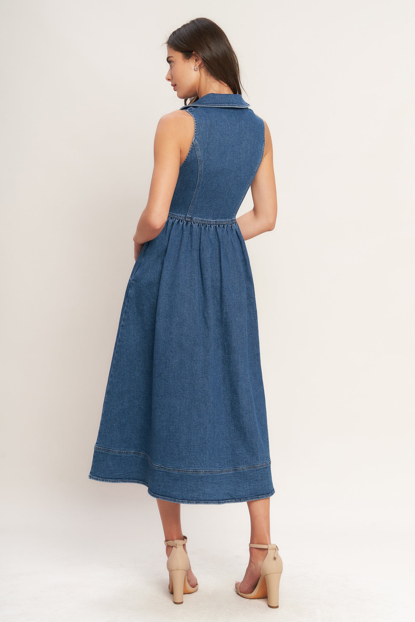 
A washed denim midi dress featuring collar, U neckline, sleeveless, front zipper closure, basque waistline and full skirt with wide hem

Details:

Self : 55% Cotton 33% Polyester 10% Viscose 2% Spandex

Size &amp; Fit

- Model is 5`8" And Wearing Size Small
- Measurements Taken From Size Small
- Approx. Length: 51" FLYING TOMATO