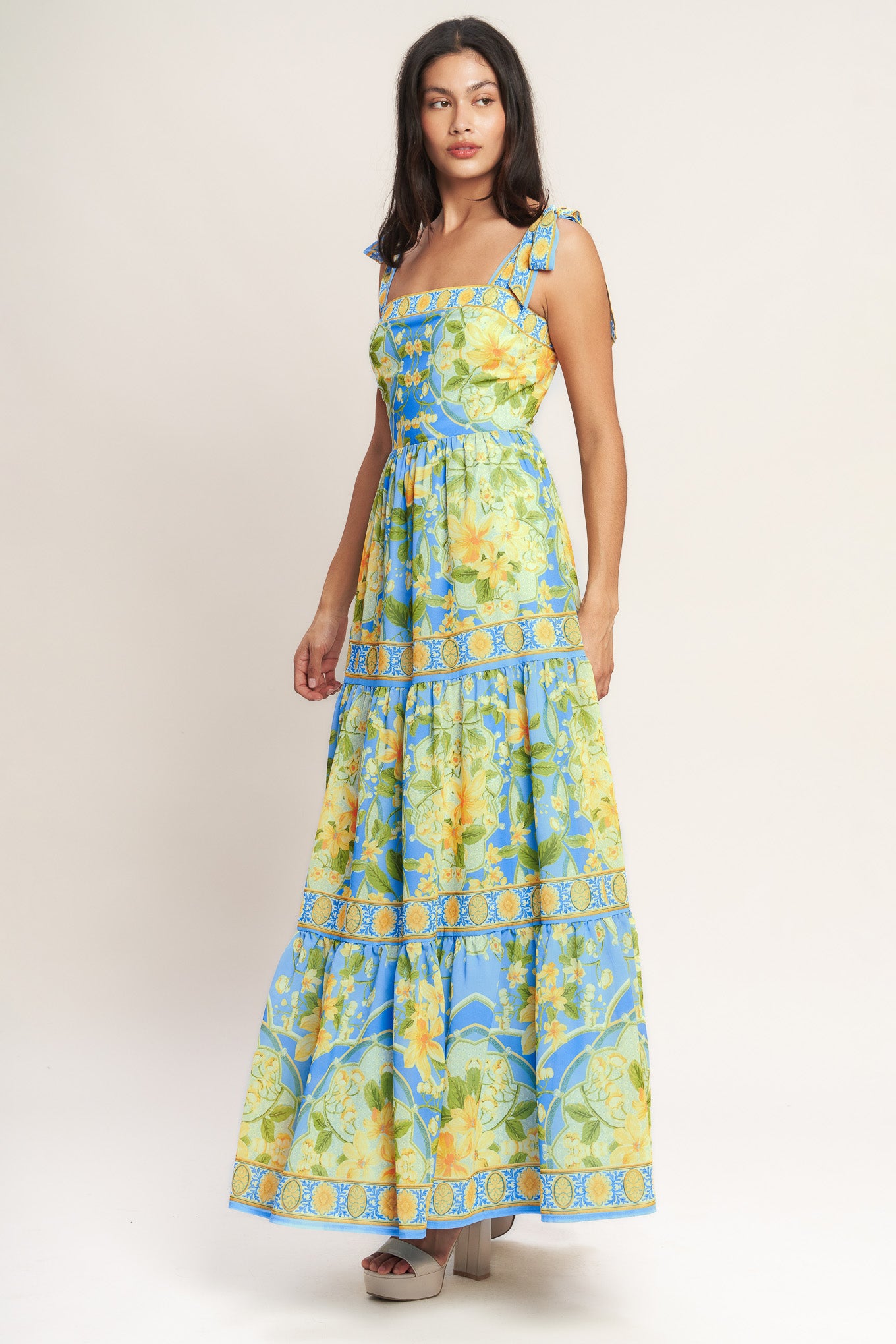 
A printed woven maxi dress featuring straight neckline, shoulder ties, tiered skirt and back zipper closure

Details:

Self : 100% Polyester
Lining : 100% Polyester

Size &amp; Fit

- Model is 5`8" And Wearing Size Small
- Measurements Taken From Size Small
- Approx. Length: 61" Flying Tomato