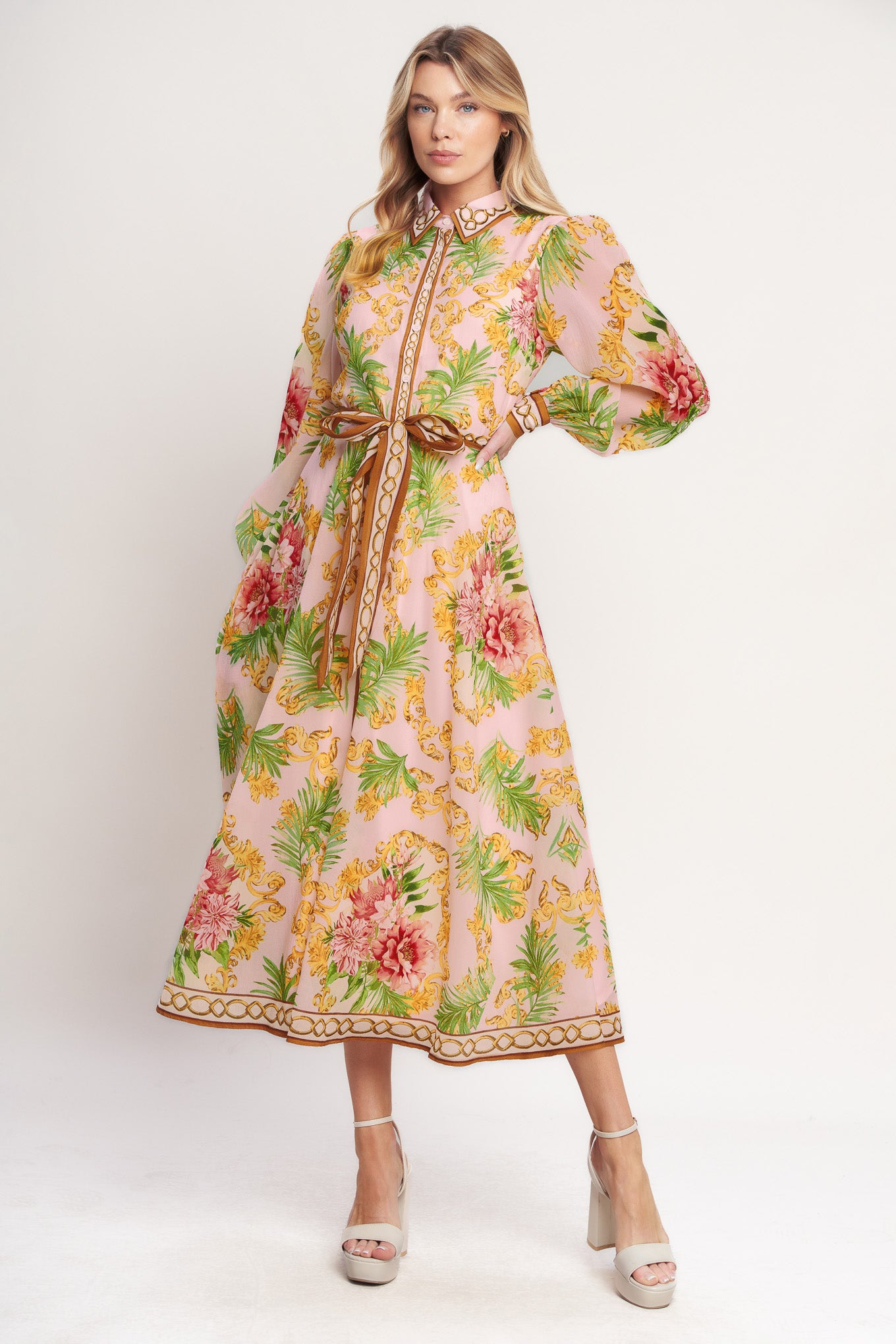 
A printed woven midi dress featuring collar, long sleeve, front button down, self sash and circle skirt

Details:

Self : 100% Polyester
Lining : 100% Polyester

Size &amp; Fit

- Model is 5`8" And Wearing Size Small
- Measurements Taken From Size Small
- Approx. Length: 51"