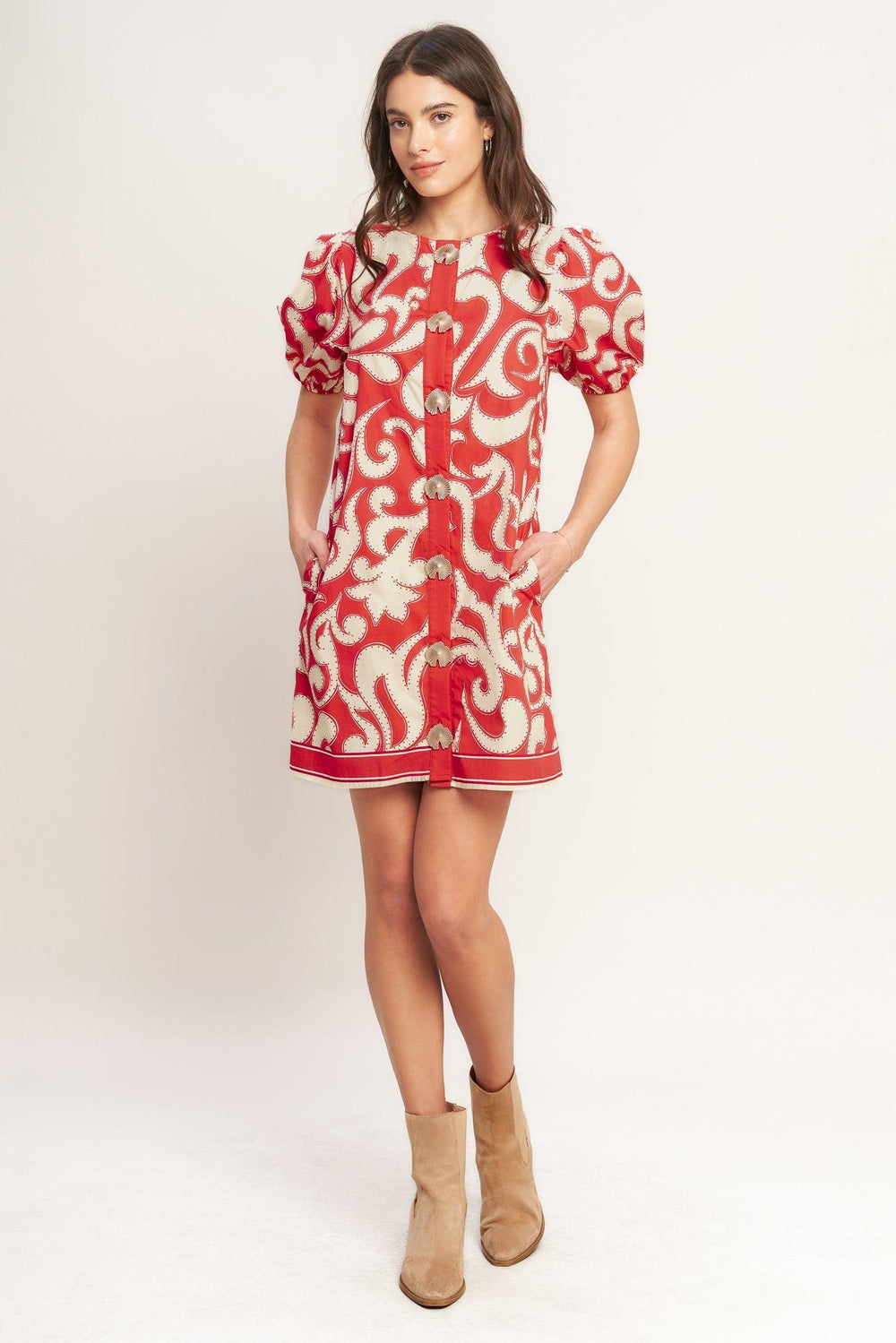
A printed woven mini dress featuring round neckline, short puff sleeve and front button down closure

Details:

Self : 100% Cotton
Lining : 100% Polyester

Size &amp; Fit

- Model is 5`8" And Wearing Size Small
- Measurements Taken From Size Small
- Approx. Length: 36" FLYING TOMATO