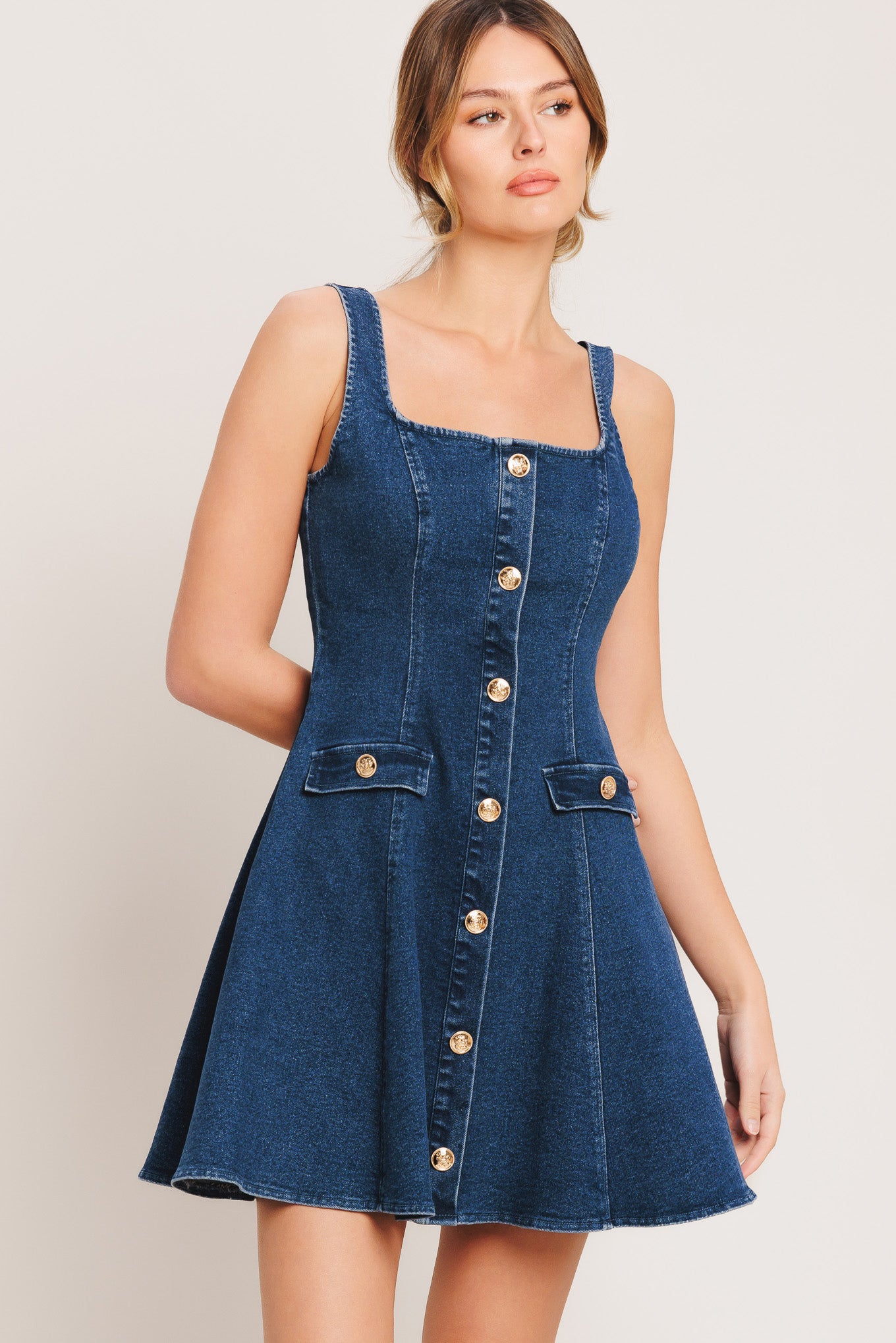 A washed denim mini dress featuring square neckline, sleeveless, button down detail, circle skirt and back zipper closure

Details:

Self: 70% Cotton 28% Polyester 2% Spandex

Size & Fit

-Model is 5`8" And Wearing Size Small
-Measurements Taken From Size Small
-Approx. Length: 34"