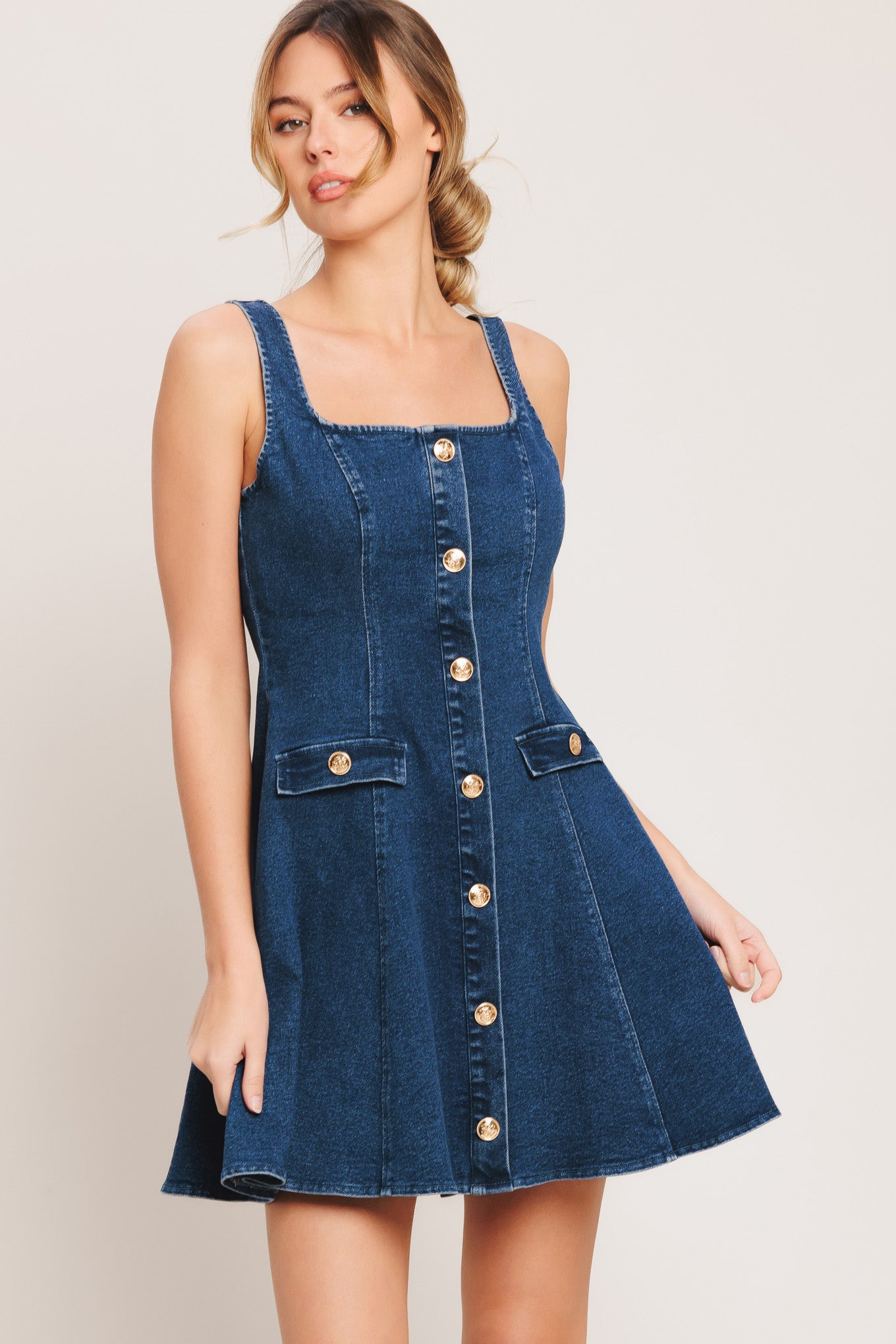 A washed denim mini dress featuring square neckline, sleeveless, button down detail, circle skirt and back zipper closure

Details:

Self: 70% Cotton 28% Polyester 2% Spandex

Size & Fit

-Model is 5`8" And Wearing Size Small
-Measurements Taken From Size Small
-Approx. Length: 34"