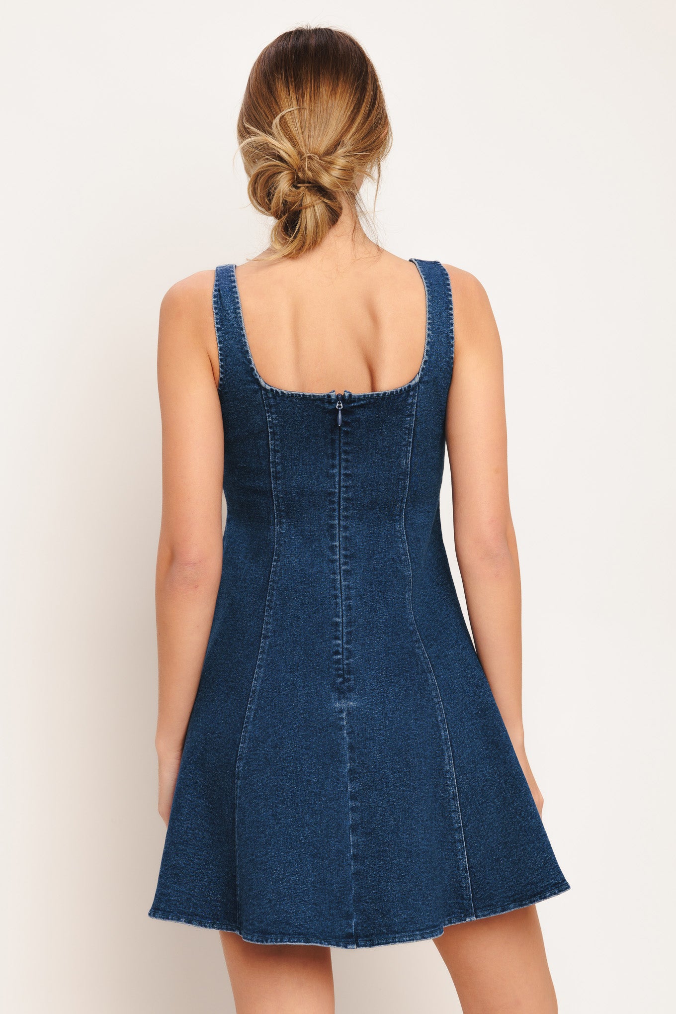 A washed denim mini dress featuring square neckline, sleeveless, button down detail, circle skirt and back zipper closure

Details:

Self: 70% Cotton 28% Polyester 2% Spandex

Size & Fit

-Model is 5`8" And Wearing Size Small
-Measurements Taken From Size Small
-Approx. Length: 34"