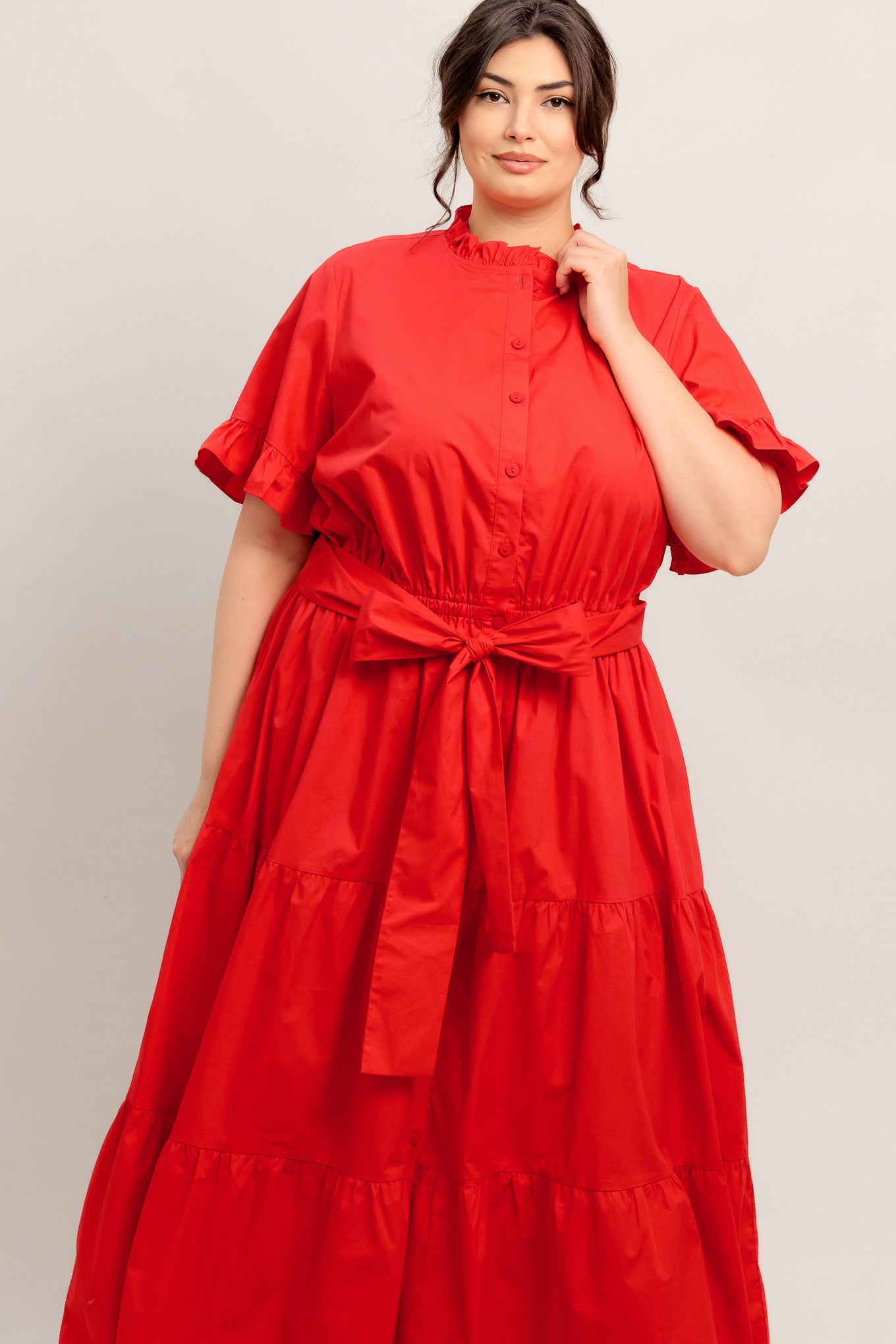 A solid woven midi dress featuring high ruffle neckline, short sleeve with ruffled edge, front button down, self sash tie and tiered skirt

Details:

Self : 100% Cotton
Lining : 100% Polyester

Size &amp; Fit

- Model is 5`8" And Wearing Size Small
- Measurements Taken From Size Small
- Approx. Length: 52" FYING TOMATO