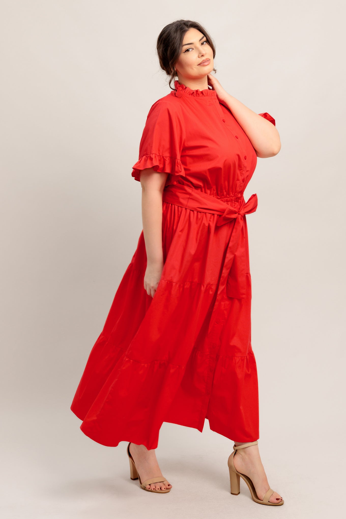 A solid woven midi dress featuring high ruffle neckline, short sleeve with ruffled edge, front button down, self sash tie and tiered skirt

Details:

Self : 100% Cotton
Lining : 100% Polyester

Size &amp; Fit

- Model is 5`8" And Wearing Size Small
- Measurements Taken From Size Small
- Approx. Length: 52" FYING TOMATO