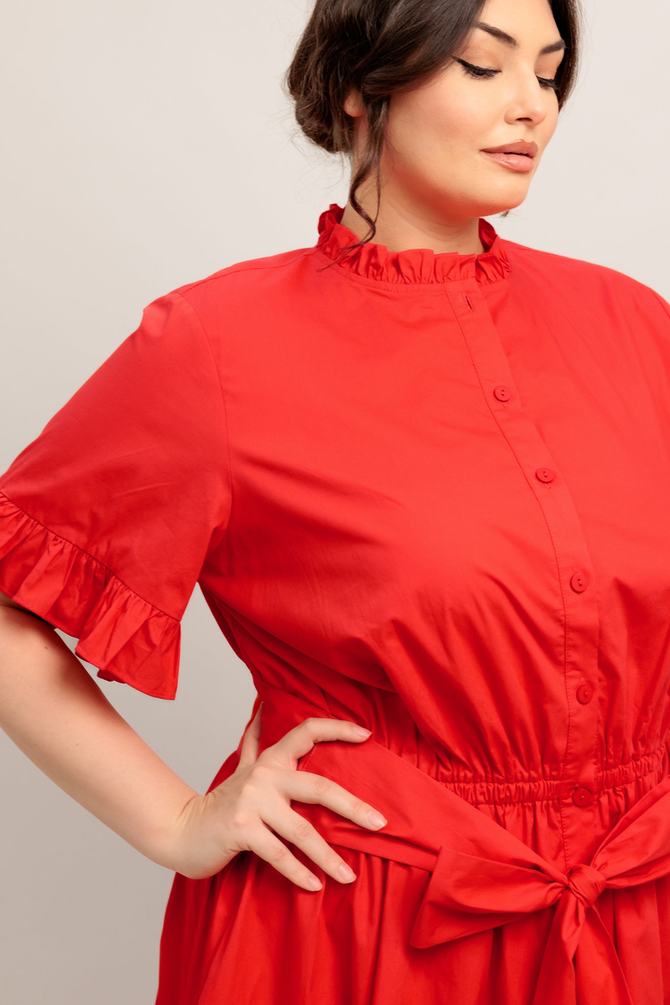 A solid woven midi dress featuring high ruffle neckline, short sleeve with ruffled edge, front button down, self sash tie and tiered skirt

Details:

Self : 100% Cotton
Lining : 100% Polyester

Size &amp; Fit

- Model is 5`8" And Wearing Size Small
- Measurements Taken From Size Small
- Approx. Length: 52" FYING TOMATO