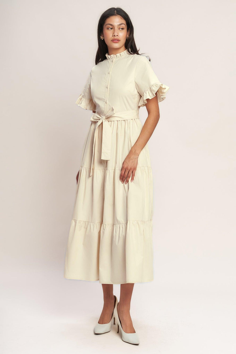 A solid woven midi dress featuring high ruffle neckline, short sleeve with ruffled edge, front button down, self sash tie and tiered skirt

Details:

Self : 100% Cotton
Lining : 100% Polyester

Size &amp; Fit

- Model is 5`8" And Wearing Size Small
- Measurements Taken From Size Small
- Approx. Length: 52" FYING TOMATO