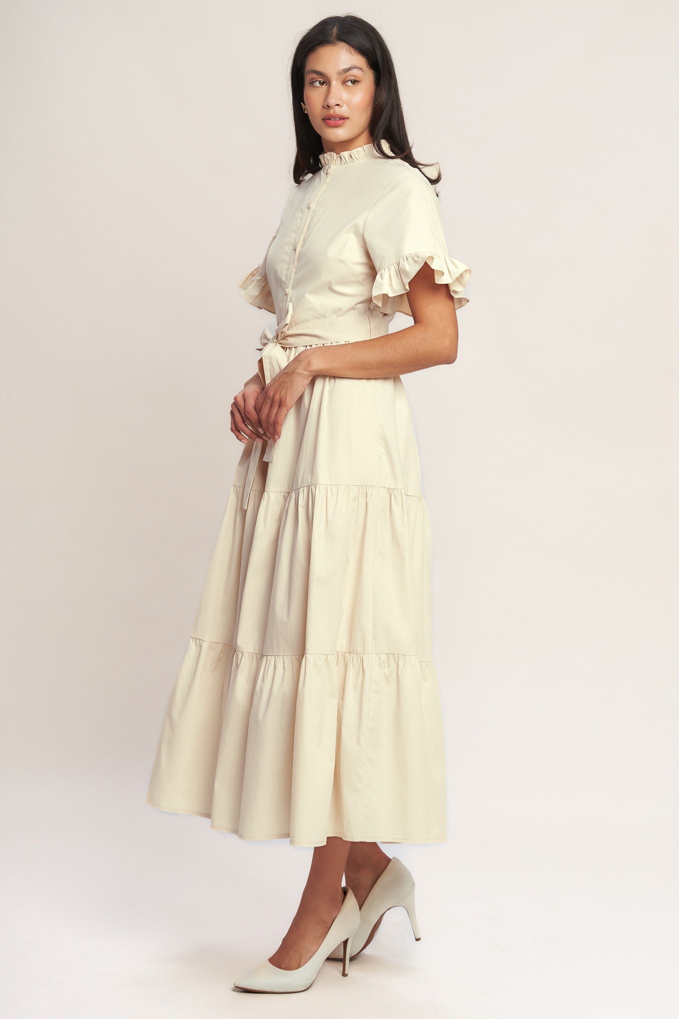 A solid woven midi dress featuring high ruffle neckline, short sleeve with ruffled edge, front button down, self sash tie and tiered skirt

Details:

Self : 100% Cotton
Lining : 100% Polyester

Size &amp; Fit

- Model is 5`8" And Wearing Size Small
- Measurements Taken From Size Small
- Approx. Length: 52" FYING TOMATO