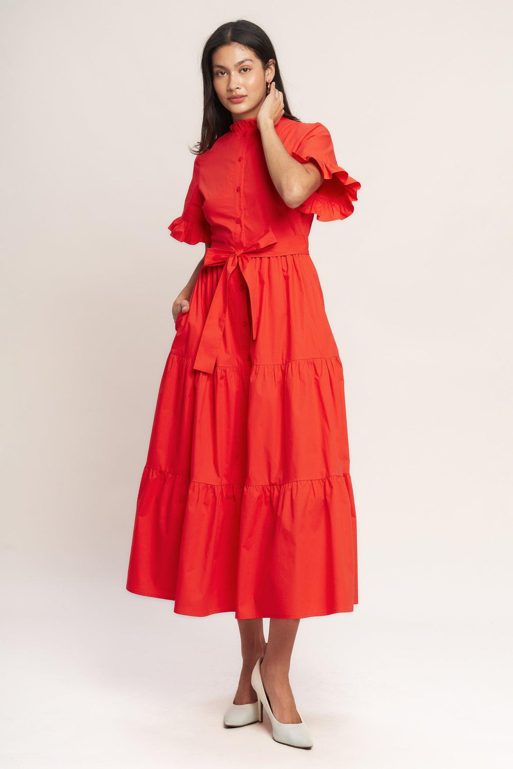 A solid woven midi dress featuring high ruffle neckline, short sleeve with ruffled edge, front button down, self sash tie and tiered skirt

Details:

Self : 100% Cotton
Lining : 100% Polyester

Size &amp; Fit

- Model is 5`8" And Wearing Size Small
- Measurements Taken From Size Small
- Approx. Length: 52" FYING TOMATO