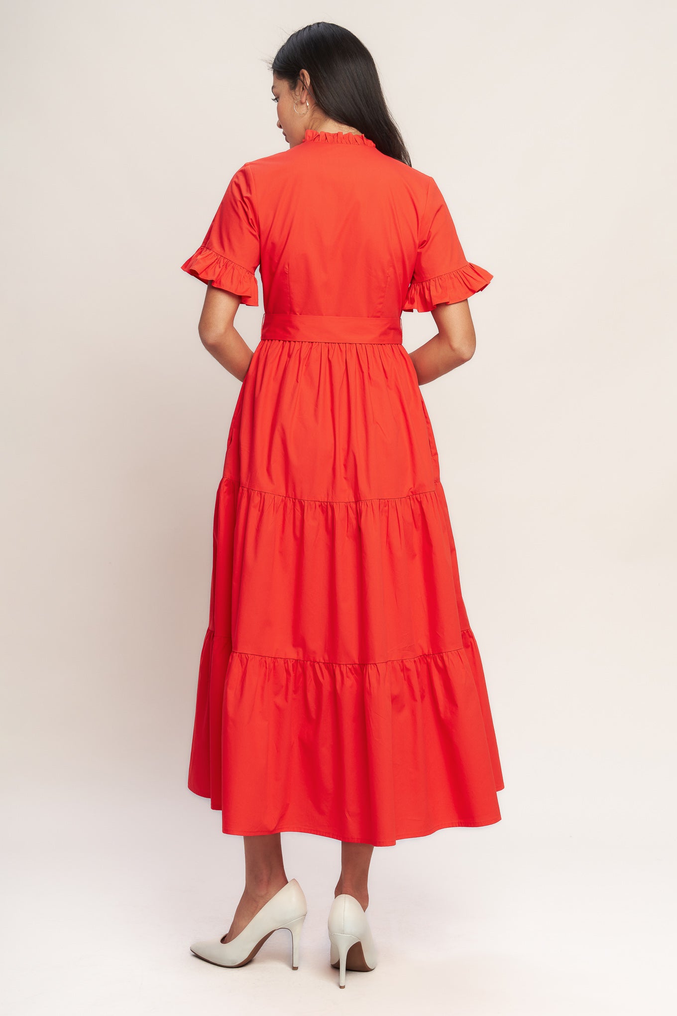 A solid woven midi dress featuring high ruffle neckline, short sleeve with ruffled edge, front button down, self sash tie and tiered skirt

Details:

Self : 100% Cotton
Lining : 100% Polyester

Size &amp; Fit

- Model is 5`8" And Wearing Size Small
- Measurements Taken From Size Small
- Approx. Length: 52" FYING TOMATO