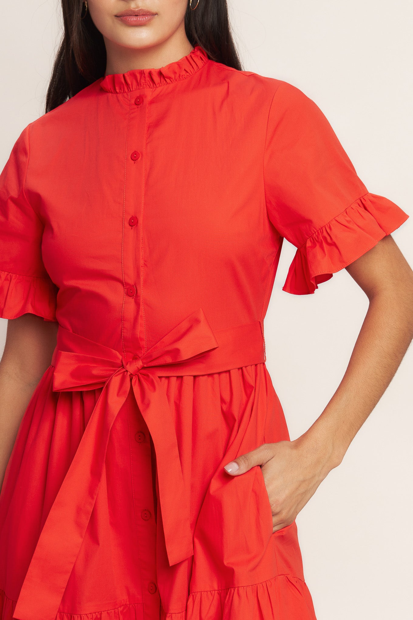 A solid woven midi dress featuring high ruffle neckline, short sleeve with ruffled edge, front button down, self sash tie and tiered skirt

Details:

Self : 100% Cotton
Lining : 100% Polyester

Size &amp; Fit

- Model is 5`8" And Wearing Size Small
- Measurements Taken From Size Small
- Approx. Length: 52" FYING TOMATO