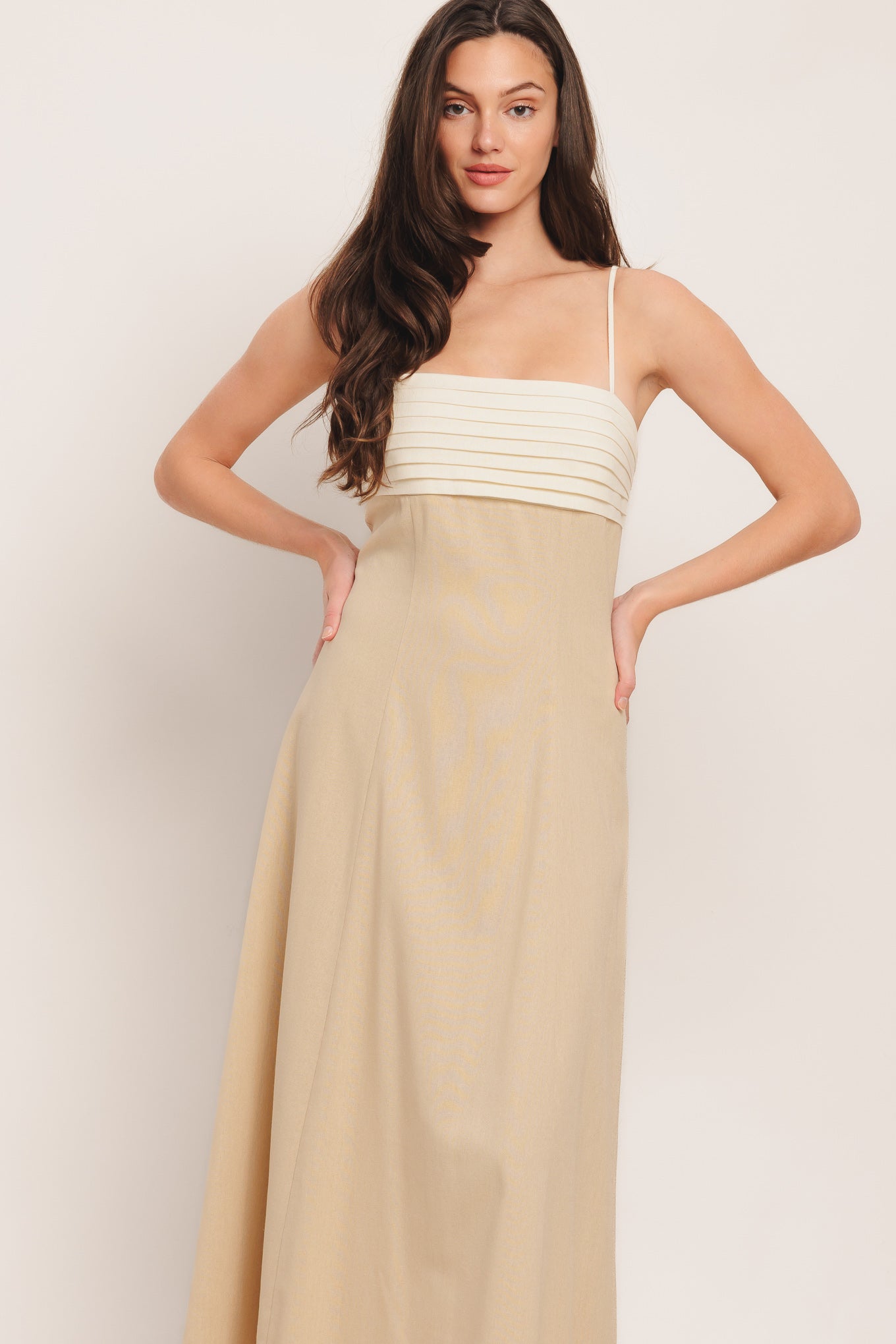 
A solid color block woven midi dress featuring straight neckline, straps, pleated bodice and back zipper detail

Details:

Self : 60% Rayon 30% Linen 10% Polyester
Contrast : 60% Rayon 30% Linen 10% Polyester
Lining : 100% Polyester

Size &amp; Fit

- Model is 5`8" And Wearing Size Small
- Measurements Taken From Size Small
- Approx. Length: 52"