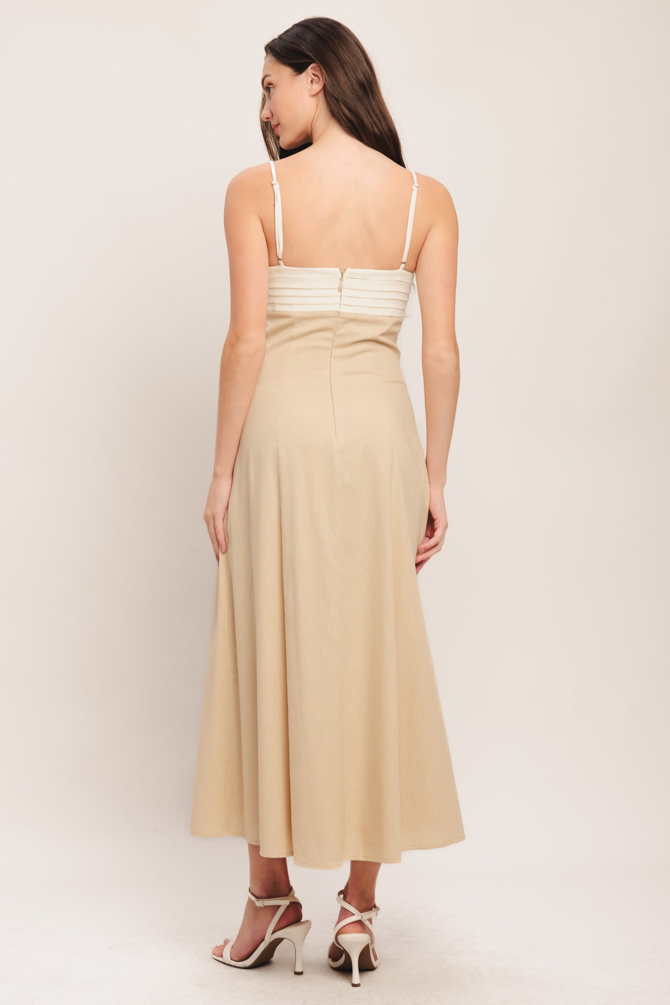 
A solid color block woven midi dress featuring straight neckline, straps, pleated bodice and back zipper detail

Details:

Self : 60% Rayon 30% Linen 10% Polyester
Contrast : 60% Rayon 30% Linen 10% Polyester
Lining : 100% Polyester

Size &amp; Fit

- Model is 5`8" And Wearing Size Small
- Measurements Taken From Size Small
- Approx. Length: 52"