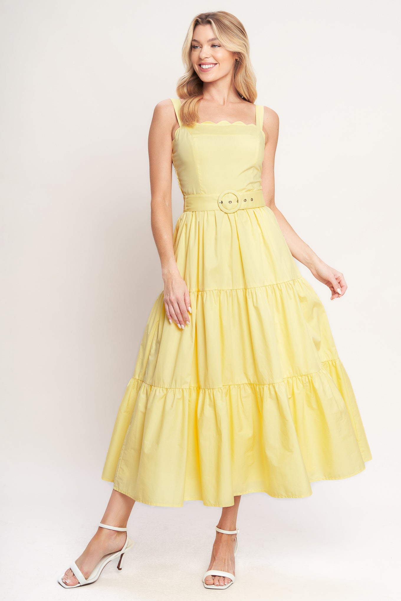 Yellow tiered midi dress with wide straps, a scalloped neckline, and a matching belt for a flattering fit

Details:

Self: 100% Cotton
Lining: 100% Polyester

Size & Fit

- Model is 5`8" And Wearing Size Small
- Measurements Taken From Size Small
- Approx. Length: 52"