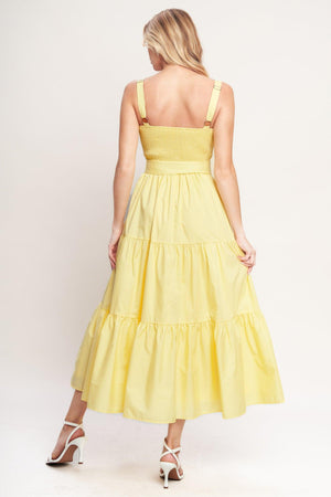 Yellow tiered midi dress with wide straps, a scalloped neckline, and a matching belt for a flattering fit

Details:

Self: 100% Cotton
Lining: 100% Polyester

Size & Fit

- Model is 5`8" And Wearing Size Small
- Measurements Taken From Size Small
- Approx. Length: 52"