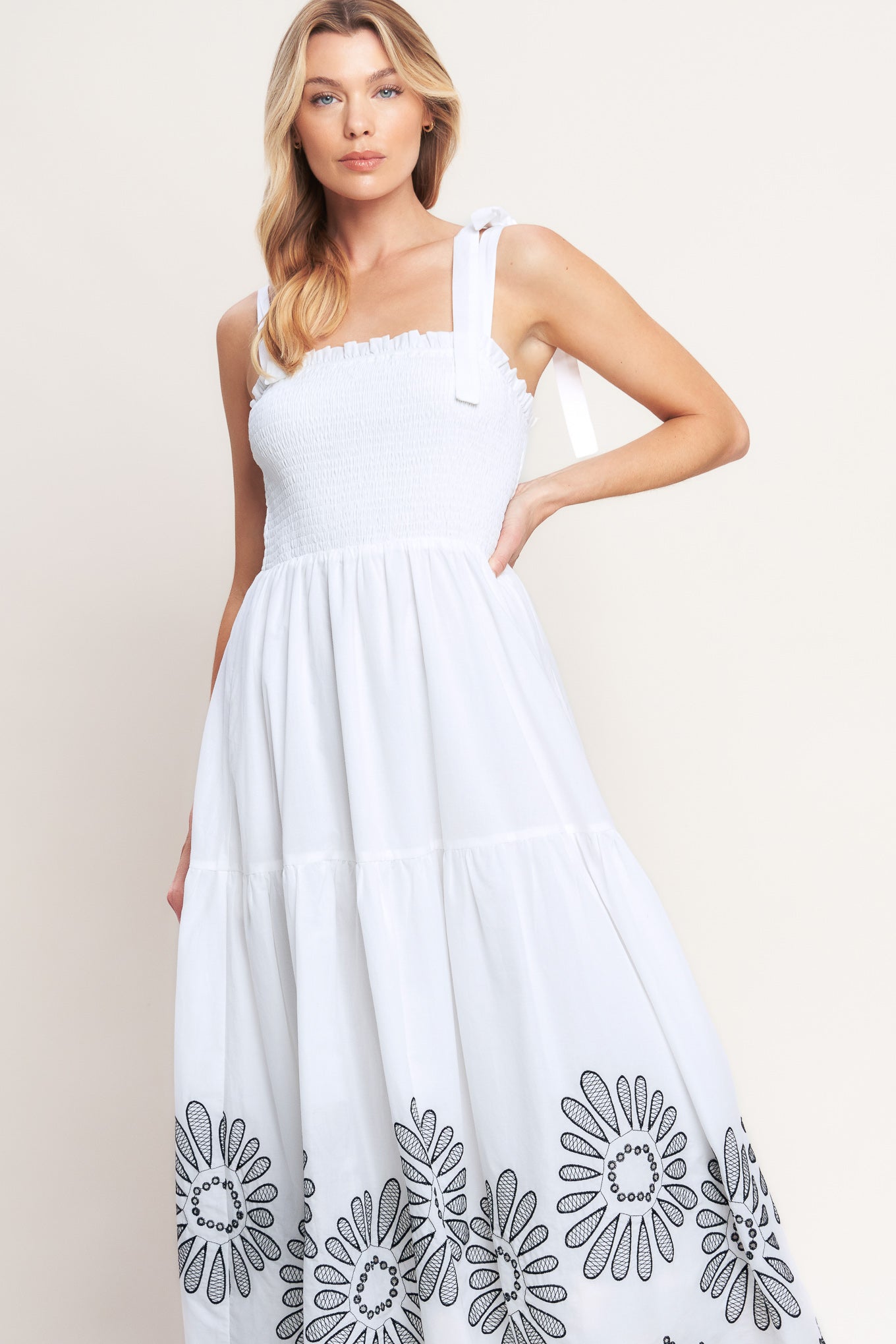 A solid woven midi dress featuring contrasting ruffle edge, shoulder tie and embroidered skirt

Details:

Self: 100% Cotton

Lining: 100% Polyester

Size & Fit

-Model is 5`8" And Wearing Size Small
-Measurements Taken From Size Small
-Approx. Length: 50"