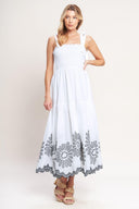 A solid woven midi dress featuring contrasting ruffle edge, shoulder tie and embroidered skirt

Details:

Self: 100% Cotton

Lining: 100% Polyester

Size & Fit

-Model is 5`8" And Wearing Size Small
-Measurements Taken From Size Small
-Approx. Length: 50"