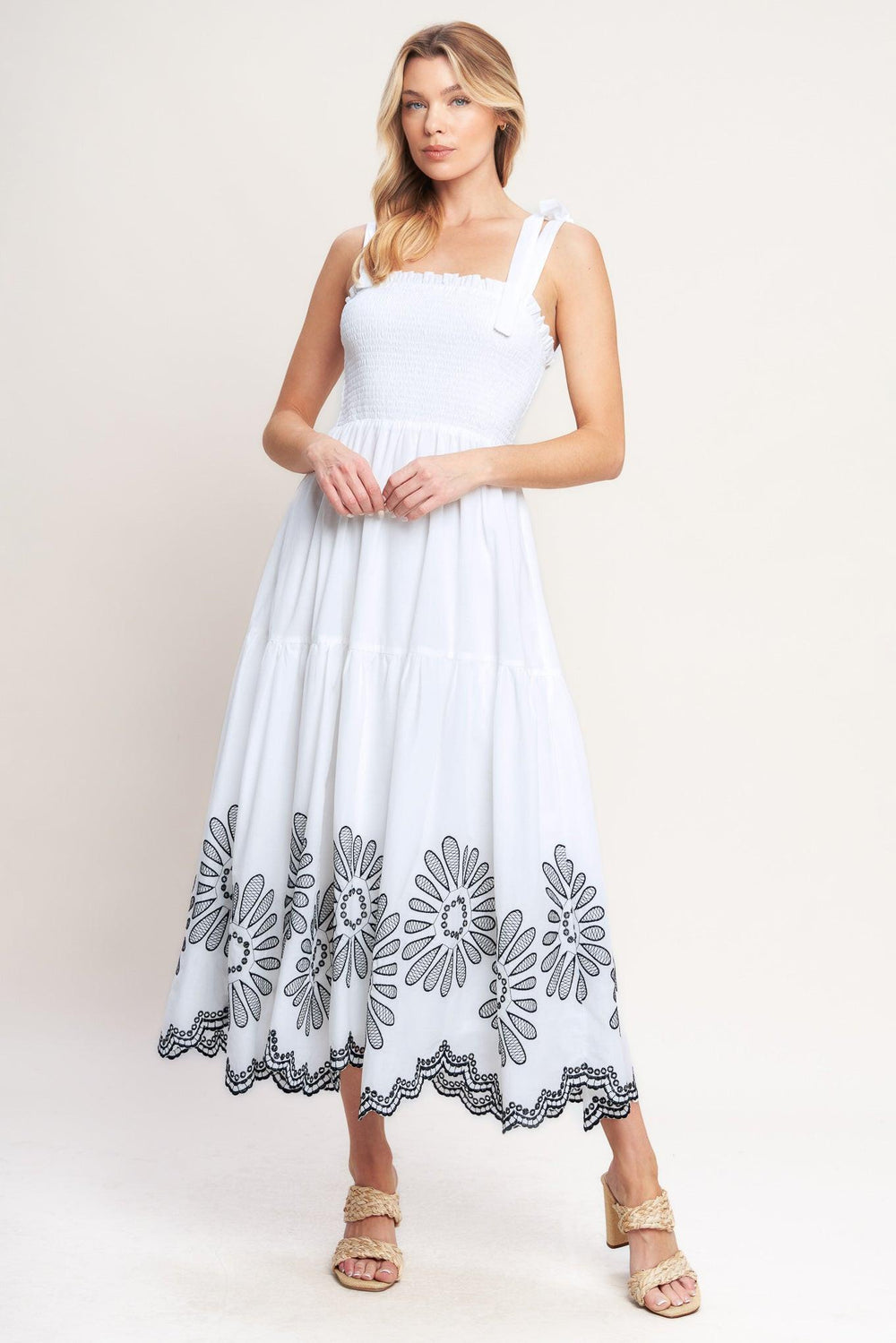 A solid woven midi dress featuring contrasting ruffle edge, shoulder tie and embroidered skirt

Details:

Self: 100% Cotton

Lining: 100% Polyester

Size & Fit

-Model is 5`8" And Wearing Size Small
-Measurements Taken From Size Small
-Approx. Length: 50"
