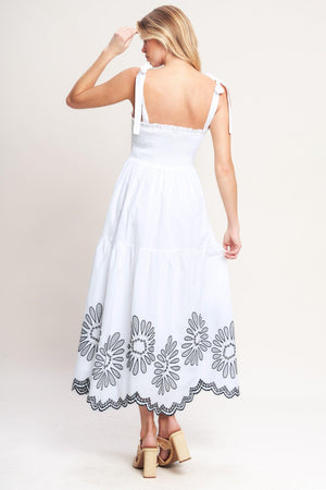 A solid woven midi dress featuring contrasting ruffle edge, shoulder tie and embroidered skirt

Details:

Self: 100% Cotton

Lining: 100% Polyester

Size & Fit

-Model is 5`8" And Wearing Size Small
-Measurements Taken From Size Small
-Approx. Length: 50"