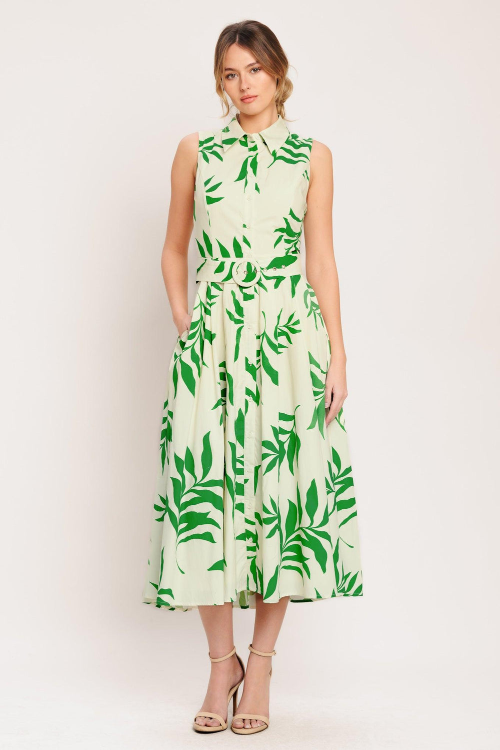 A printed woven midi dress featuring collar, sleeveless, button down, self belt and full skirt

Details:

Self: 100% Cotton

Lining: 100% Polyester

Size & Fit

-Model is 5`8" And Wearing Size Small
-Measurements Taken From Size Small
-Approx. Length: 52"