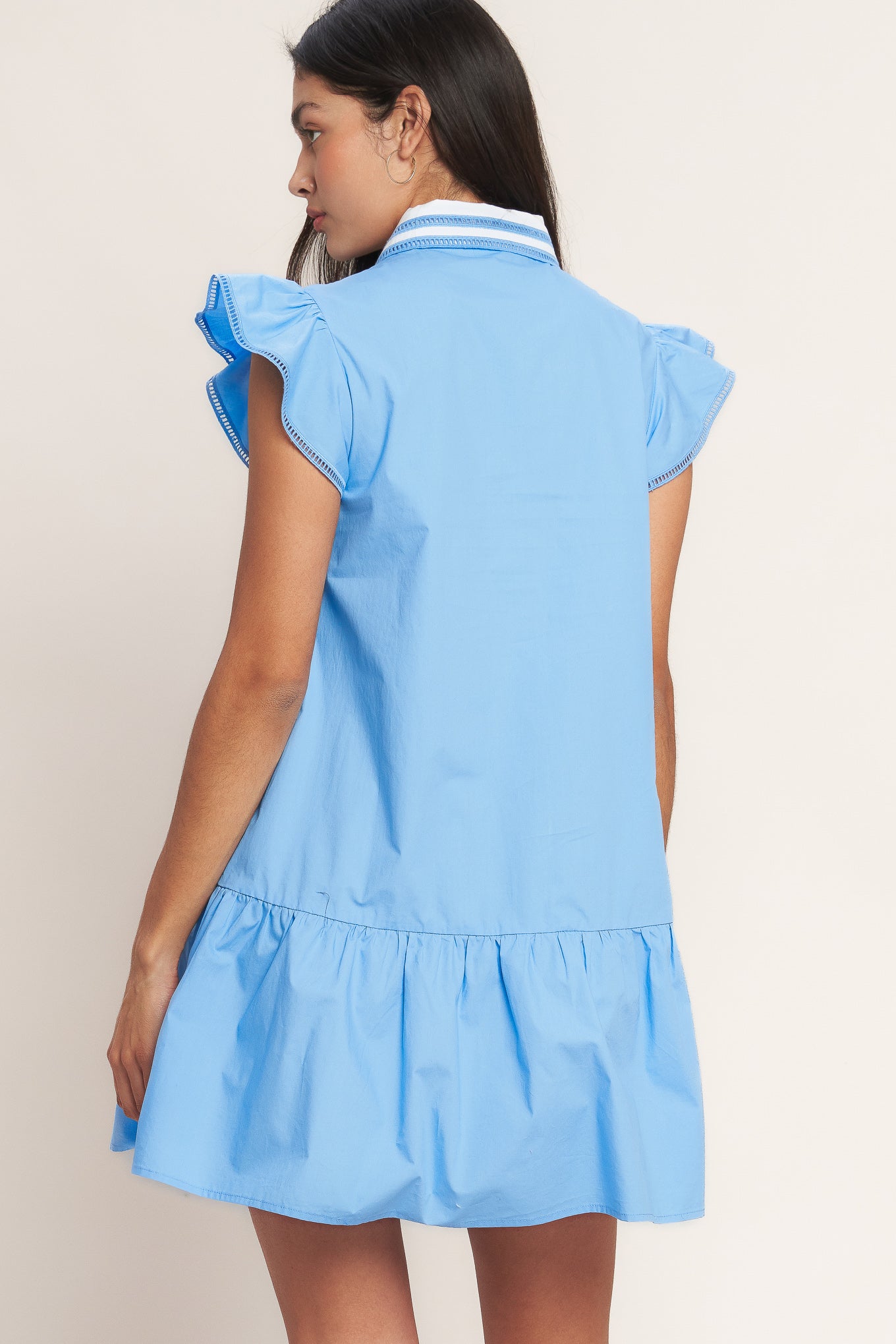 
A solid woven mini dress featuring lace inset collar, button down, ruffle sleeve with lace trim and ruffle hemline

Details:

Self : 100% Cotton
Contrast : 100% Cotton

Size &amp; Fit

- Model is 5`8" And Wearing Size Small
- Measurements Taken From Size Small
- Approx. Length: 35" FLYING TOMAOT