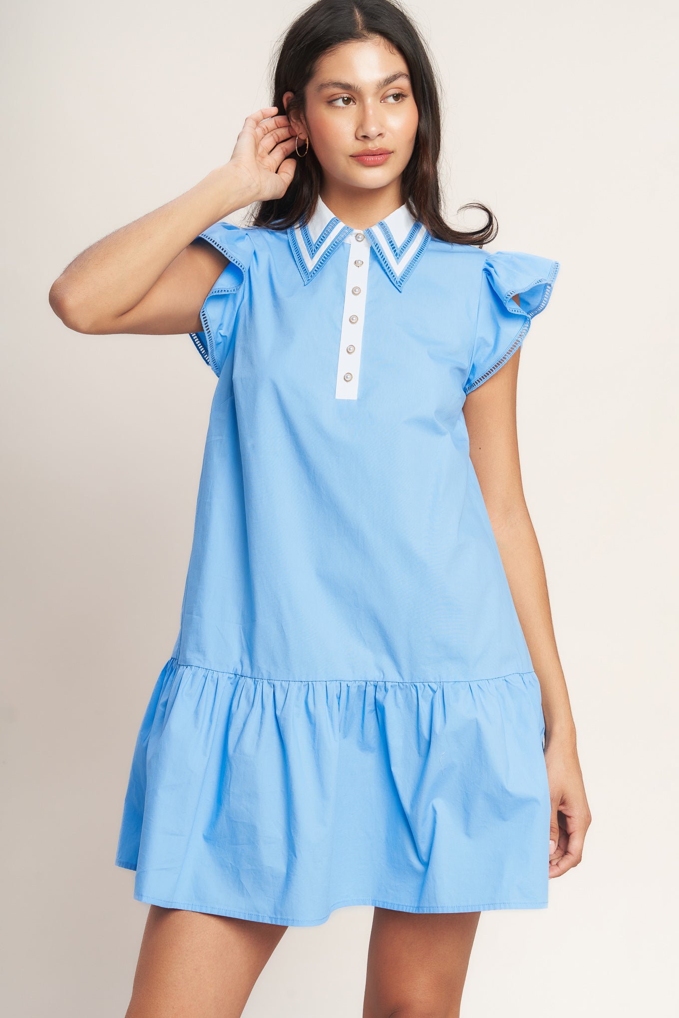 
A solid woven mini dress featuring lace inset collar, button down, ruffle sleeve with lace trim and ruffle hemline

Details:

Self : 100% Cotton
Contrast : 100% Cotton

Size &amp; Fit

- Model is 5`8" And Wearing Size Small
- Measurements Taken From Size Small
- Approx. Length: 35" FLYING TOMAOT